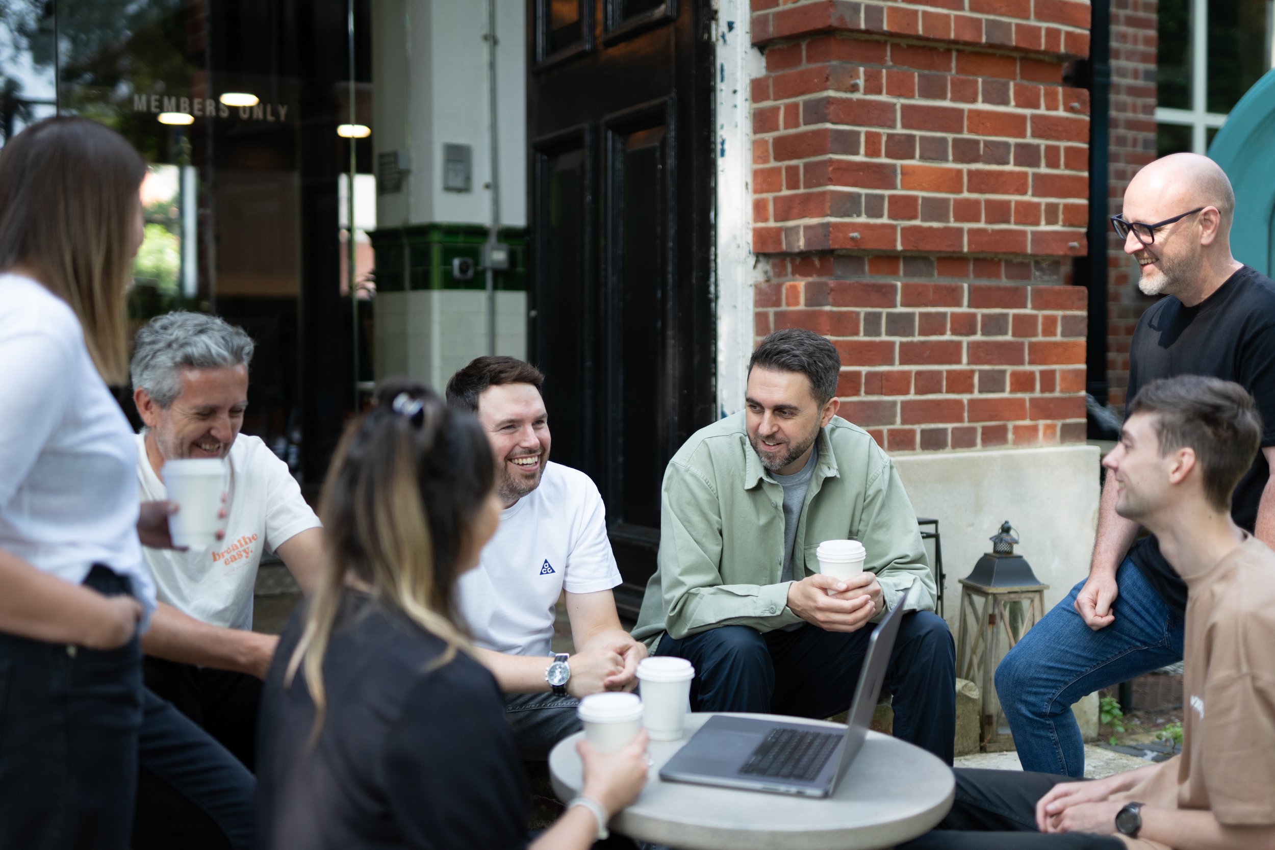 The creative team at Glassup &amp; Stoski sit outside and discuss current projects