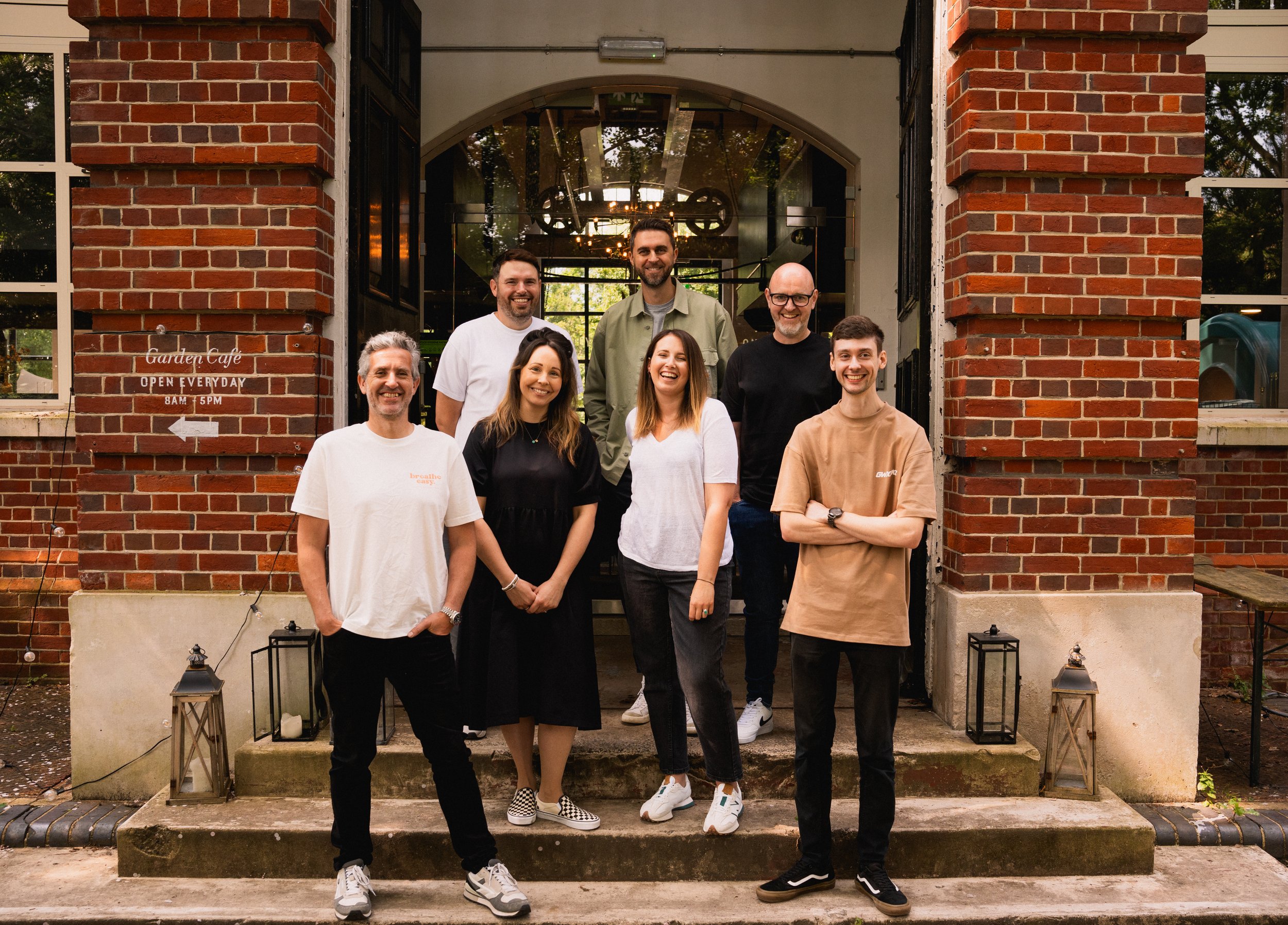 The Glassup and Stoski team standing on the steps in front of the Winchester design office