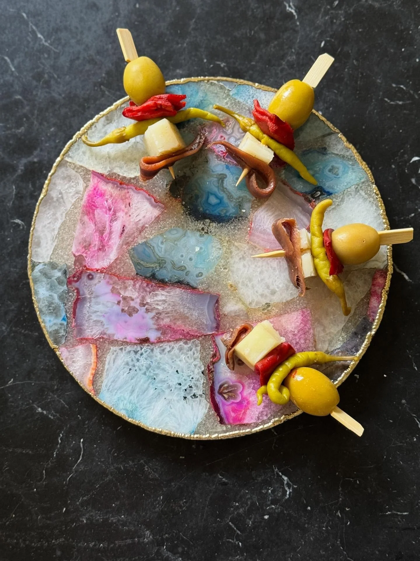 The Aperitif ✨
The Gilda &mdash; a timeless Spanish pintxo, balancing salty, spicy, and savory notes:
🫒 Olive
🌶️ Piquillo pepper. 
🌶️ Guindilla (piparra)
🧀 Manchego
🐟 Anchovy

Perfectly paired with a glass of Spanish Vermut Siderit Reserva 2022 