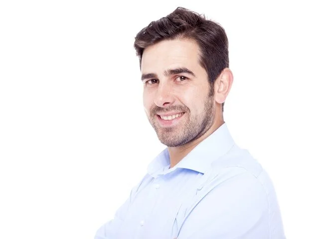 guy smiling and looking at the camera-min.jpg