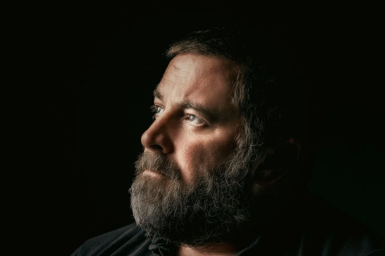 a-bearded-man-looking-up