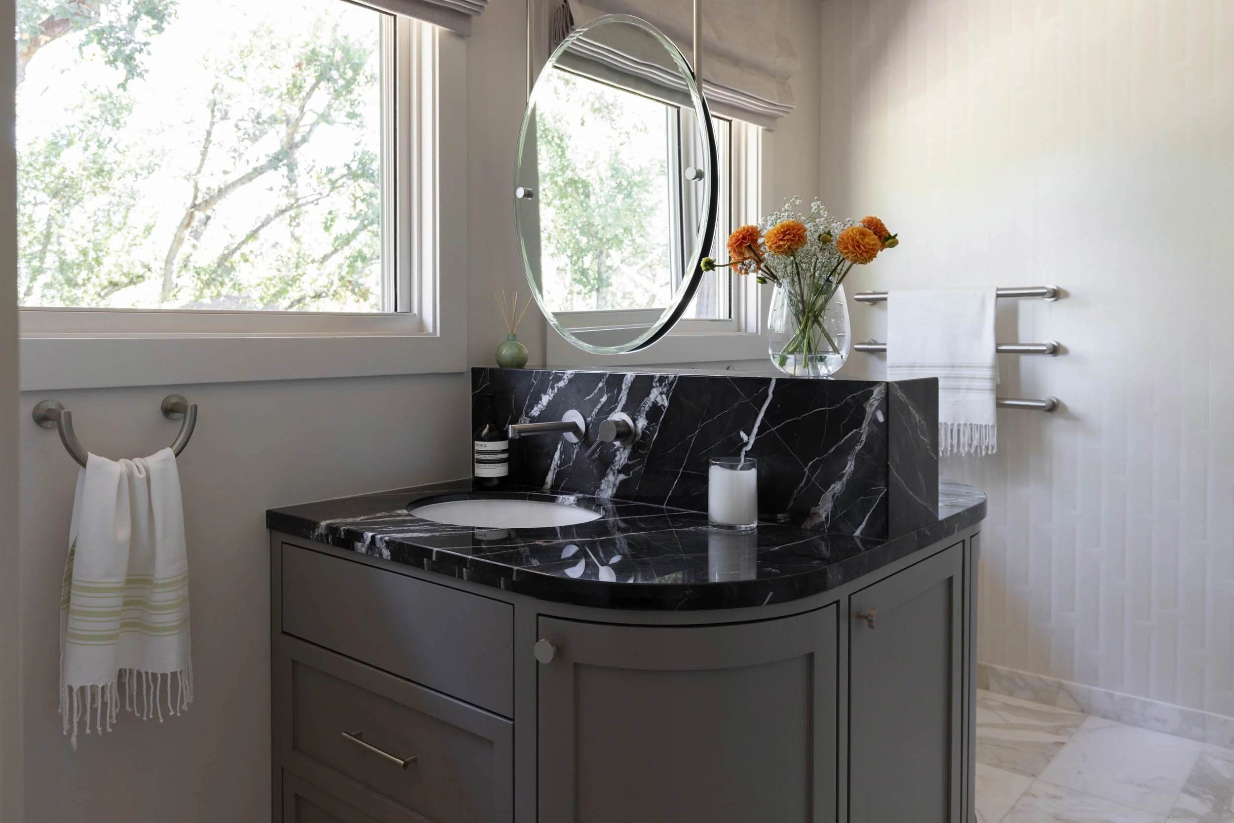 Marble double vanity with ceiling hung mirror