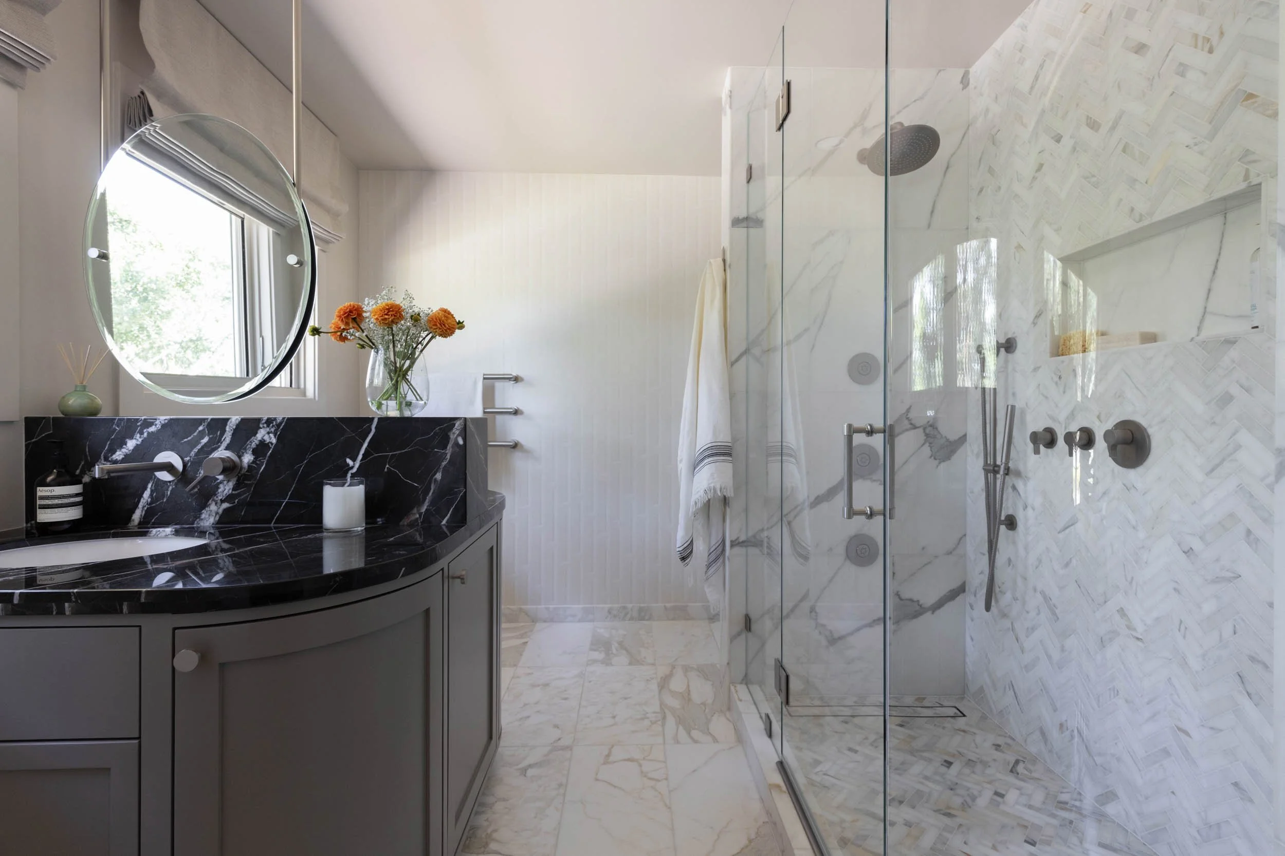 Marble double vanity bathroom with walk-in shower