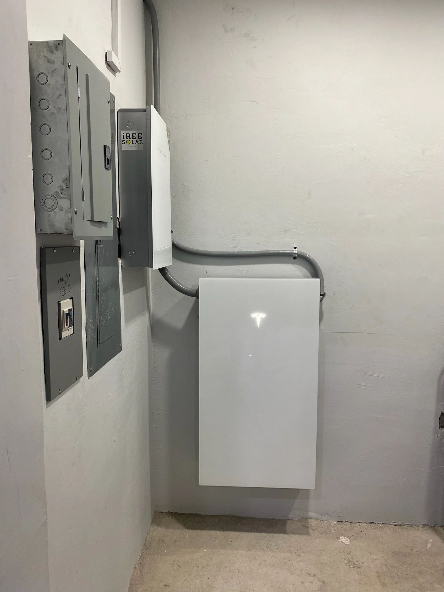 Tesla powerwall 3 and Tesla gateway 3 installed indoors in an electrical room