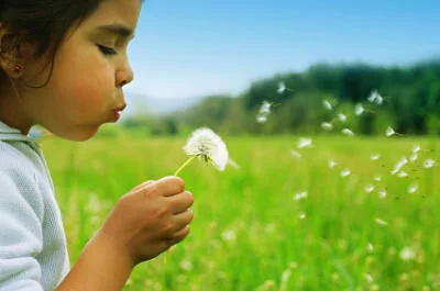 Child with dandelion.jpeg