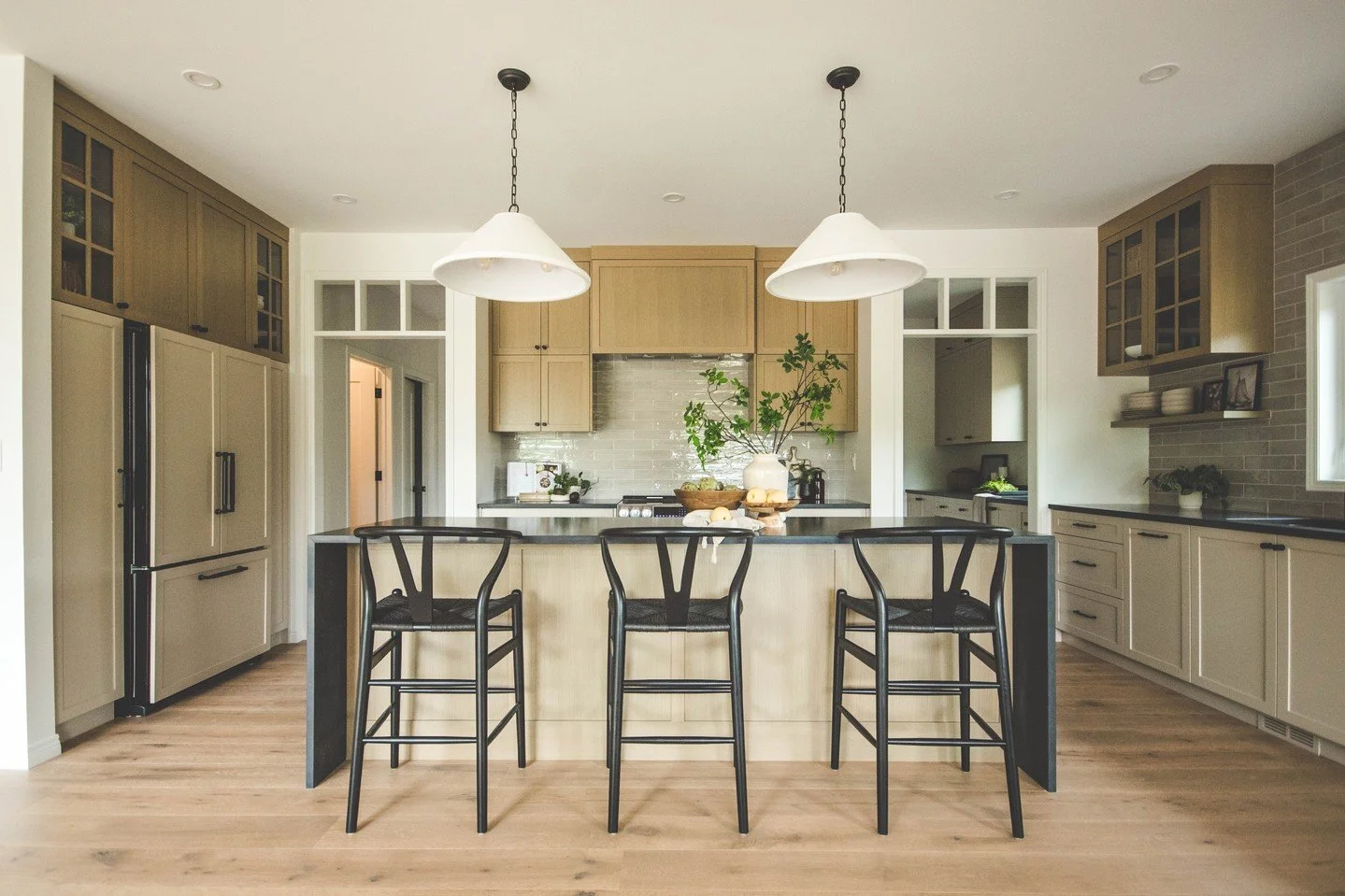 We introduced our full Wallace Project a few posts back, but this kitchen deserves a spotlight of its own. ✨⁠
⁠
Earthy tones, black and ivory accents, and touches of natural greenery bring a warmth that extends far beyond the heart of the home.⁠
⁠
Cl
