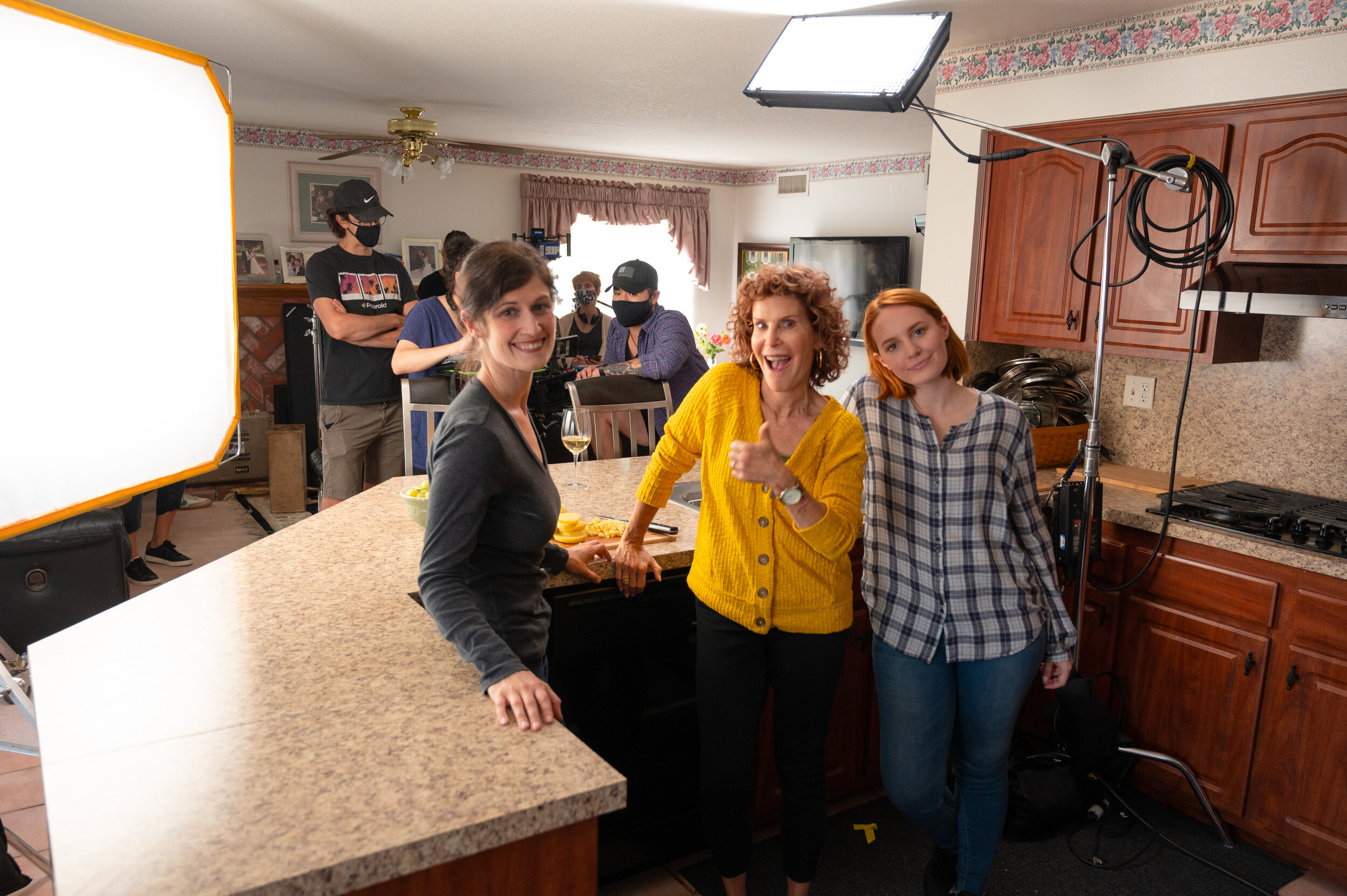 Actresses Smiling with crew in bg.jpeg