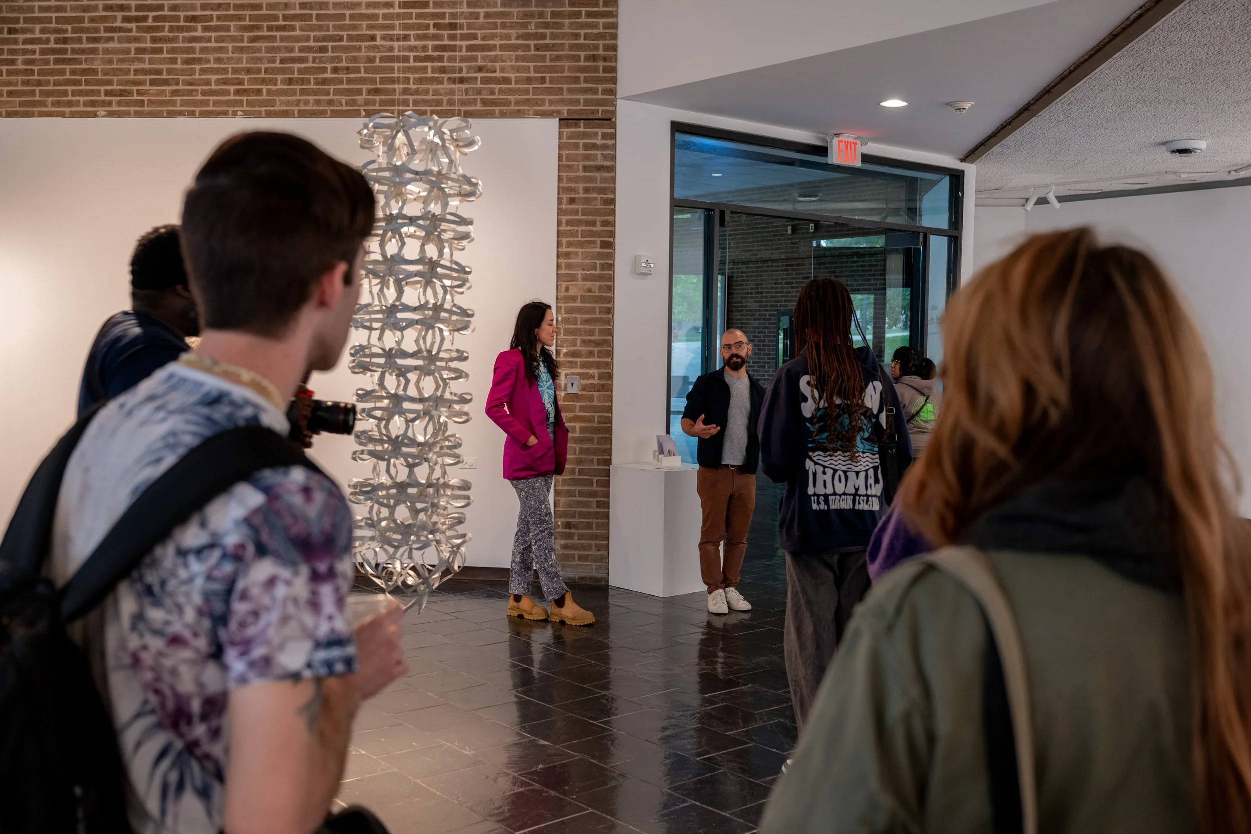 artist Kate Rusek and gallery director Joseph Morris speaking at gallery opening