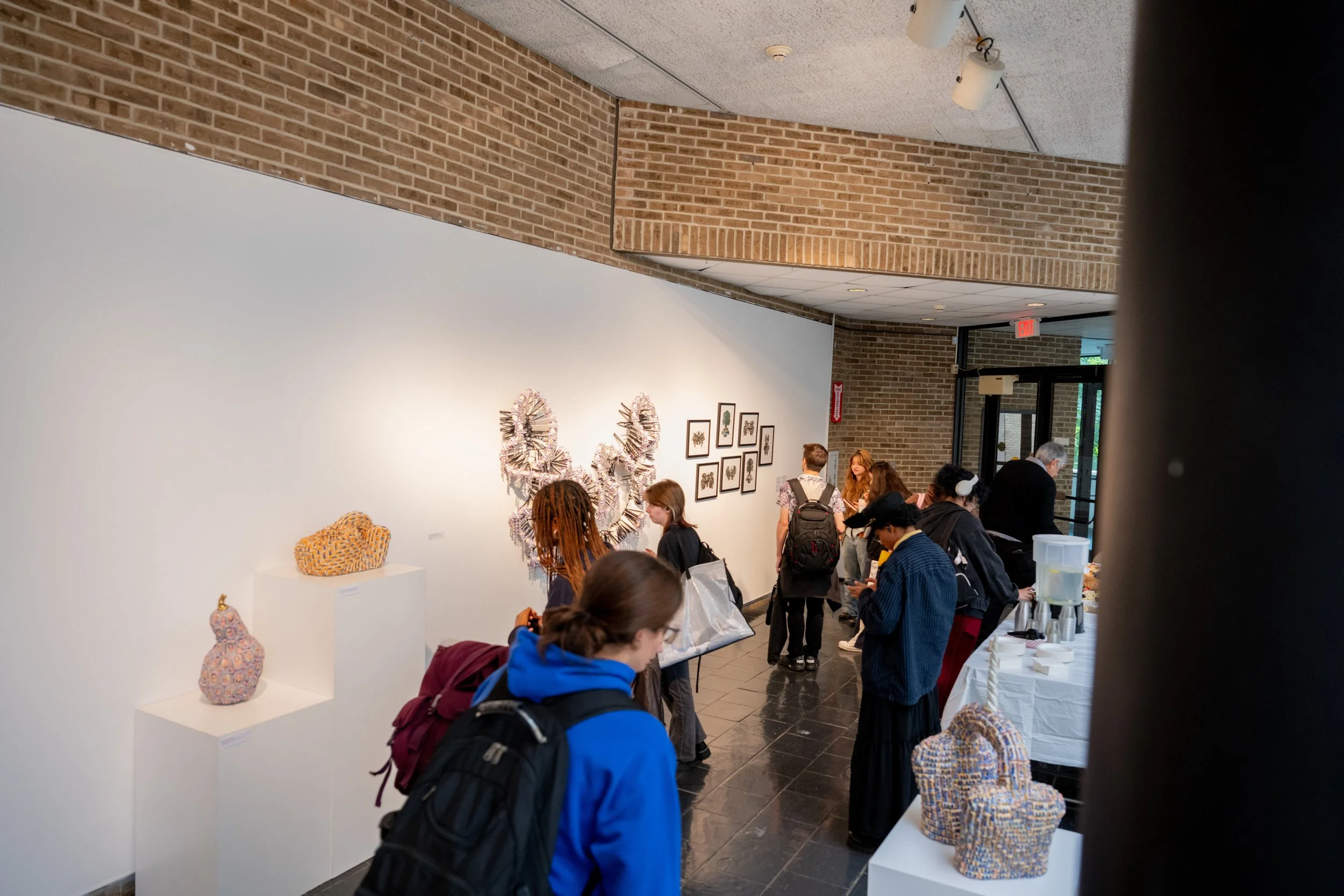 viewers looking at Kate Rusek artworks