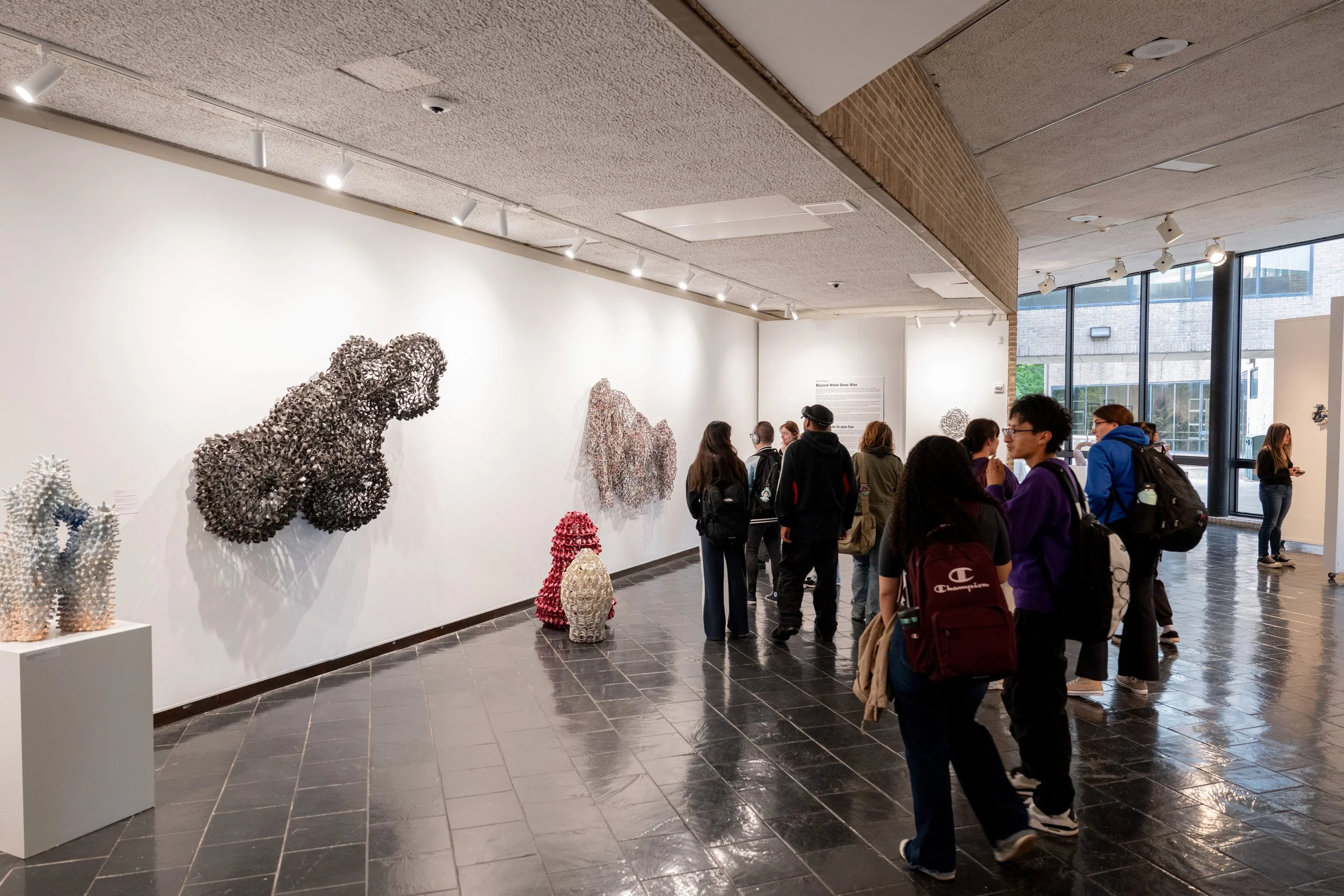 viewers looking at Kate Rusek artworks