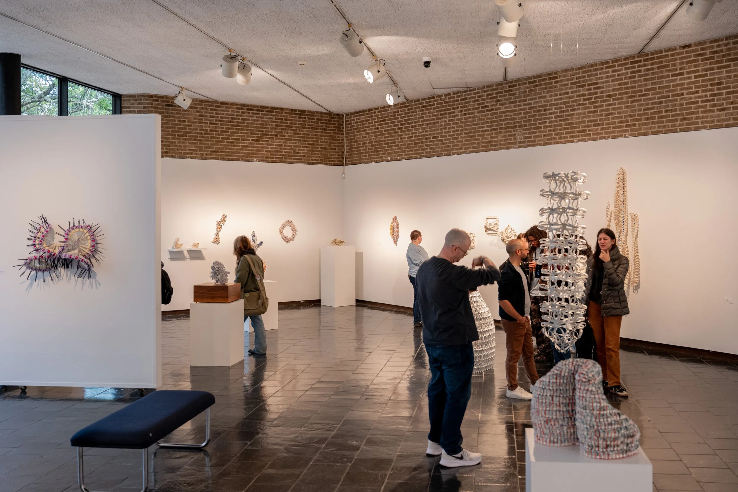 viewers looking at Kate Rusek artworks