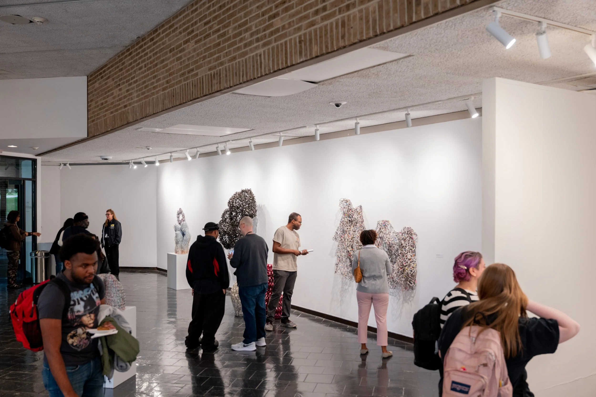 viewers looking at Kate Rusek artworks