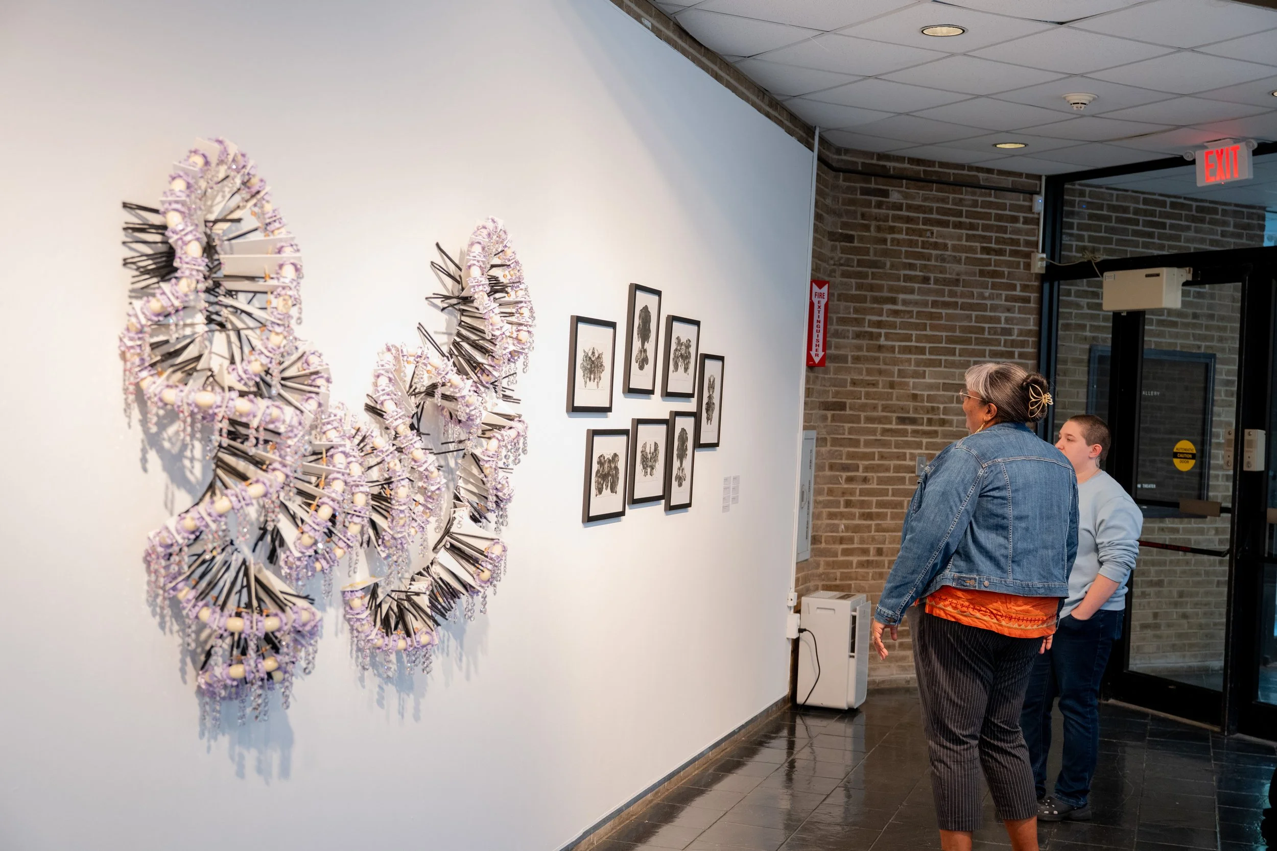 viewers looking at Kate Rusek artwork