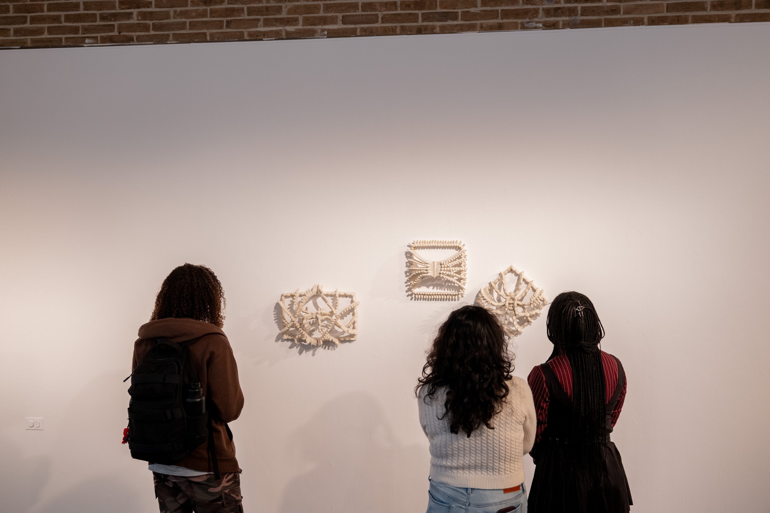 viewers looking at Kate Rusek artworks
