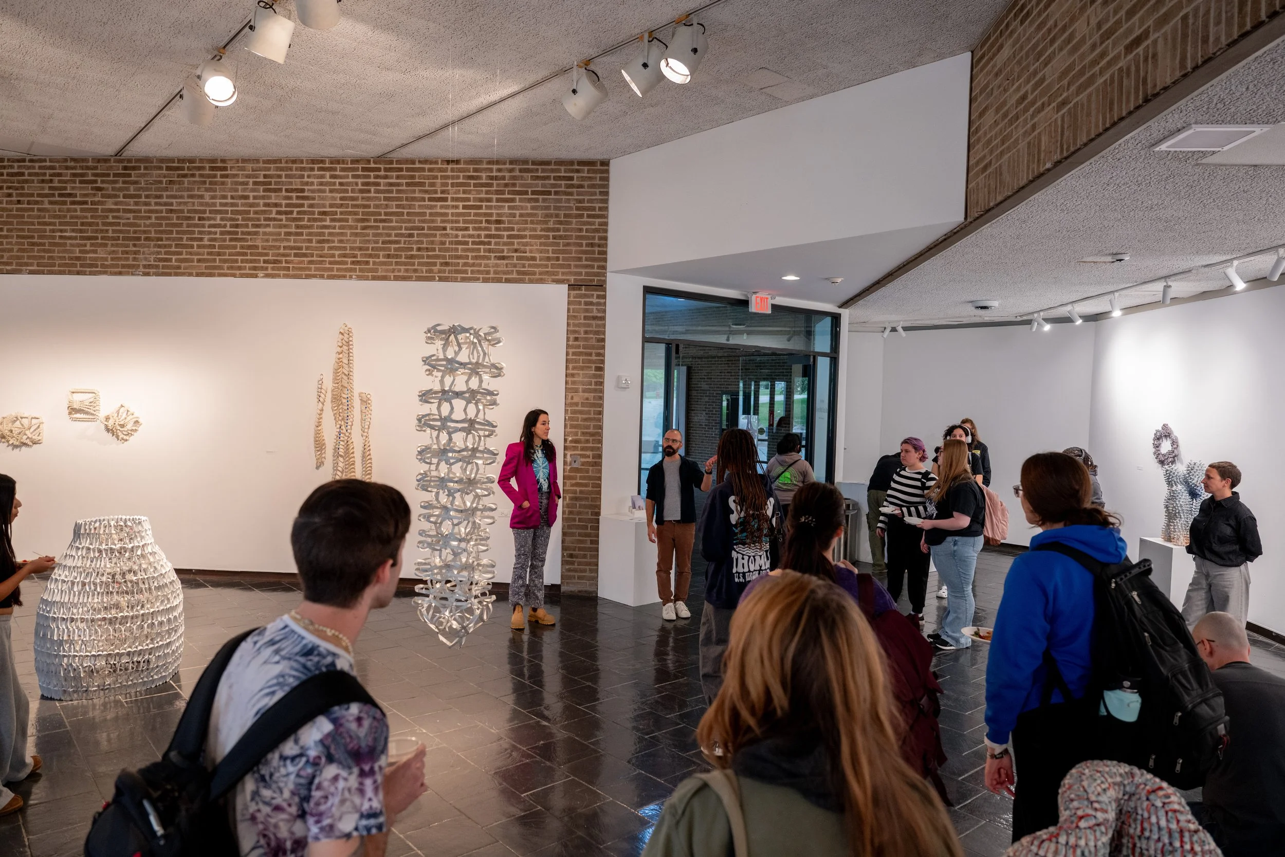 artist Kate Rusek and gallery director Joseph Morris speaking at gallery opening