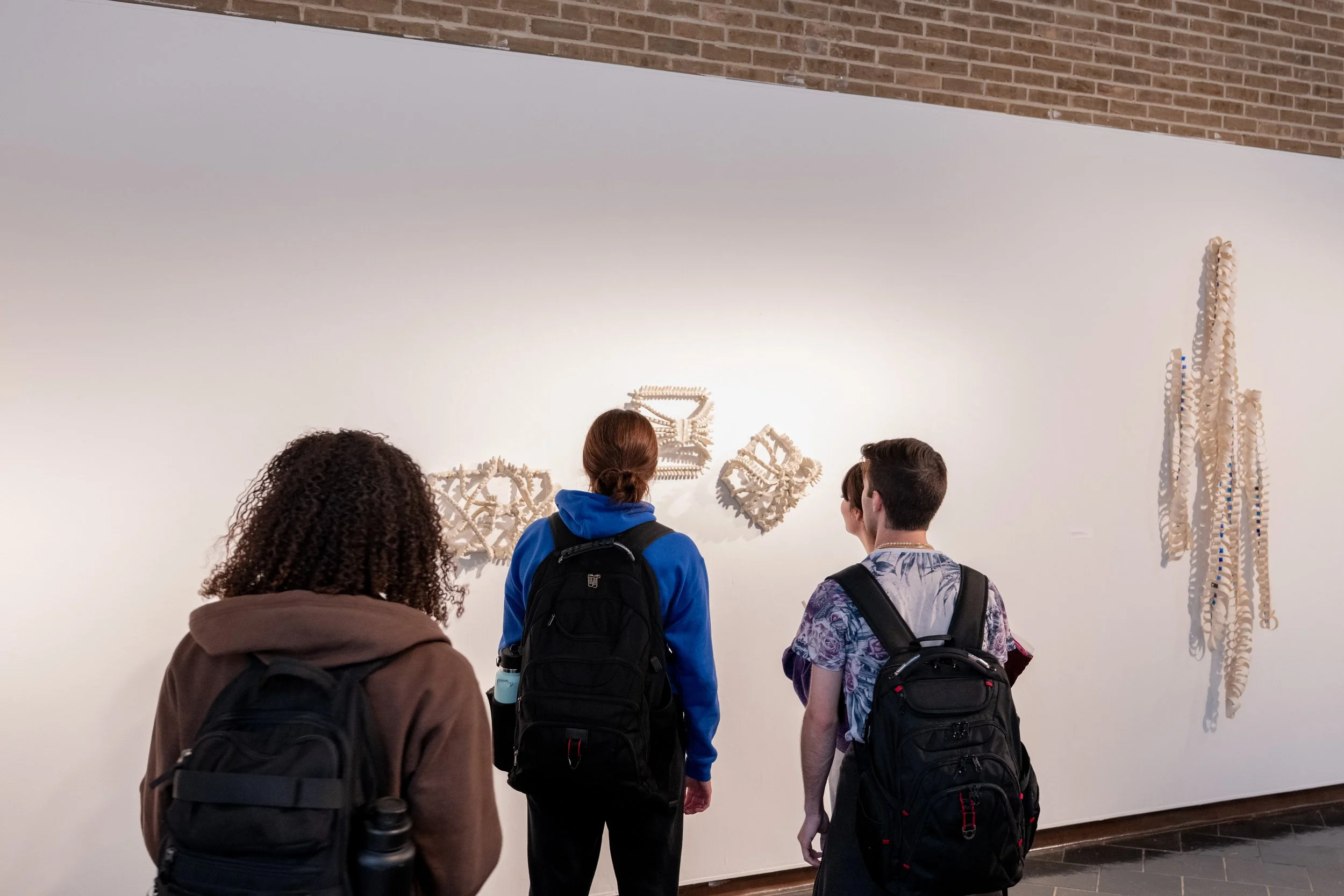 viewers looking at Kate Rusek artwork