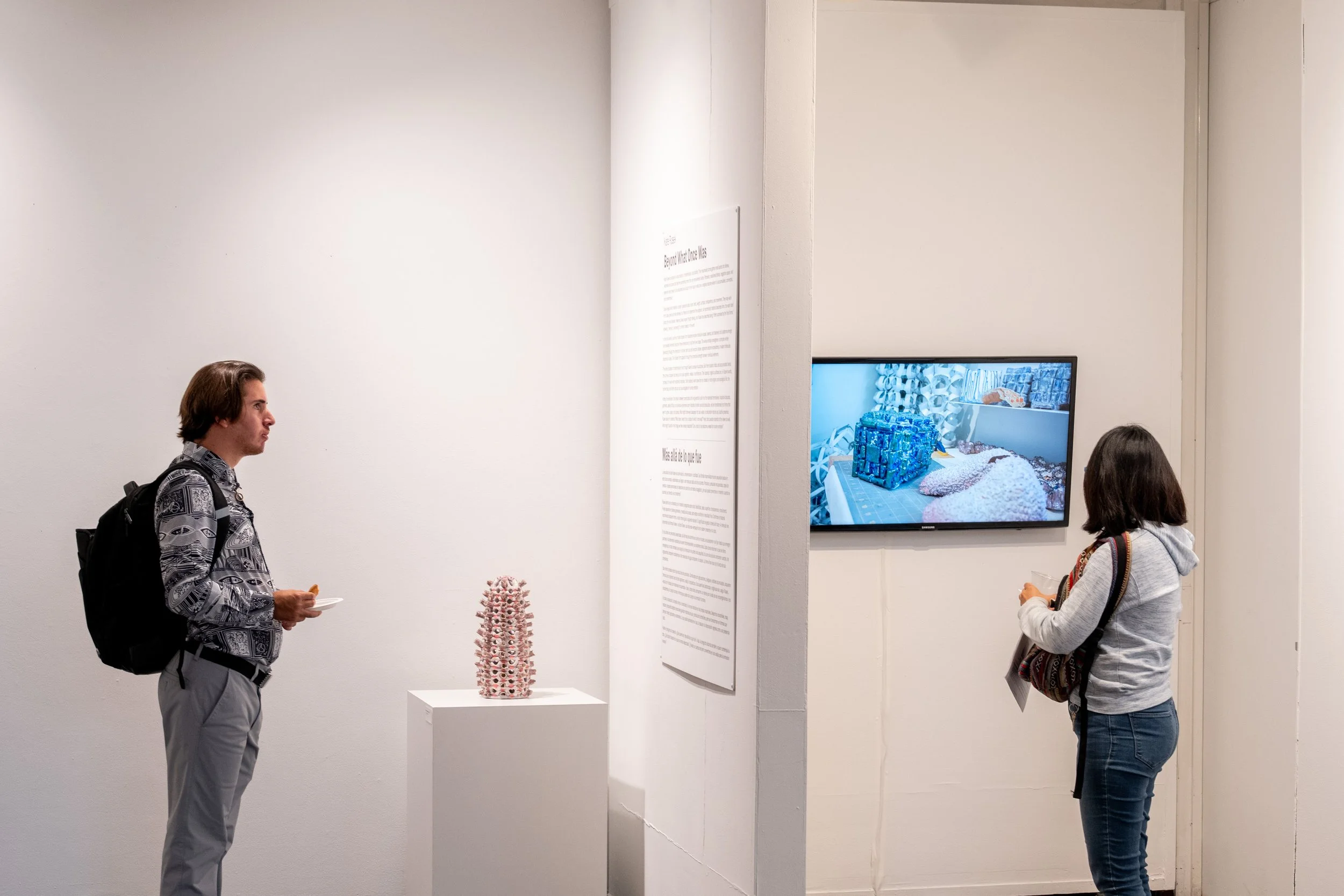 viewer looking at Kate Rusek sculpture