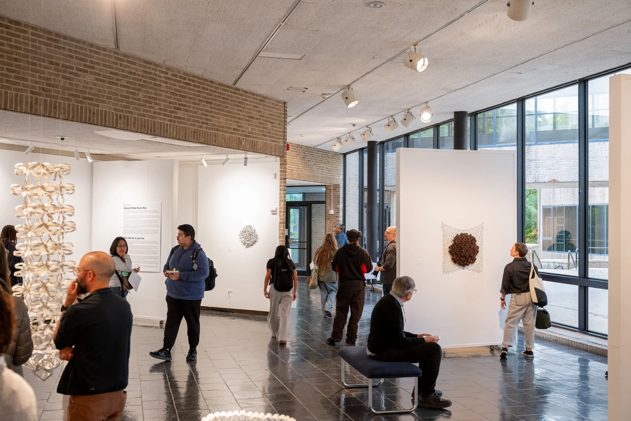viewers looking at Kate Rusek artwork