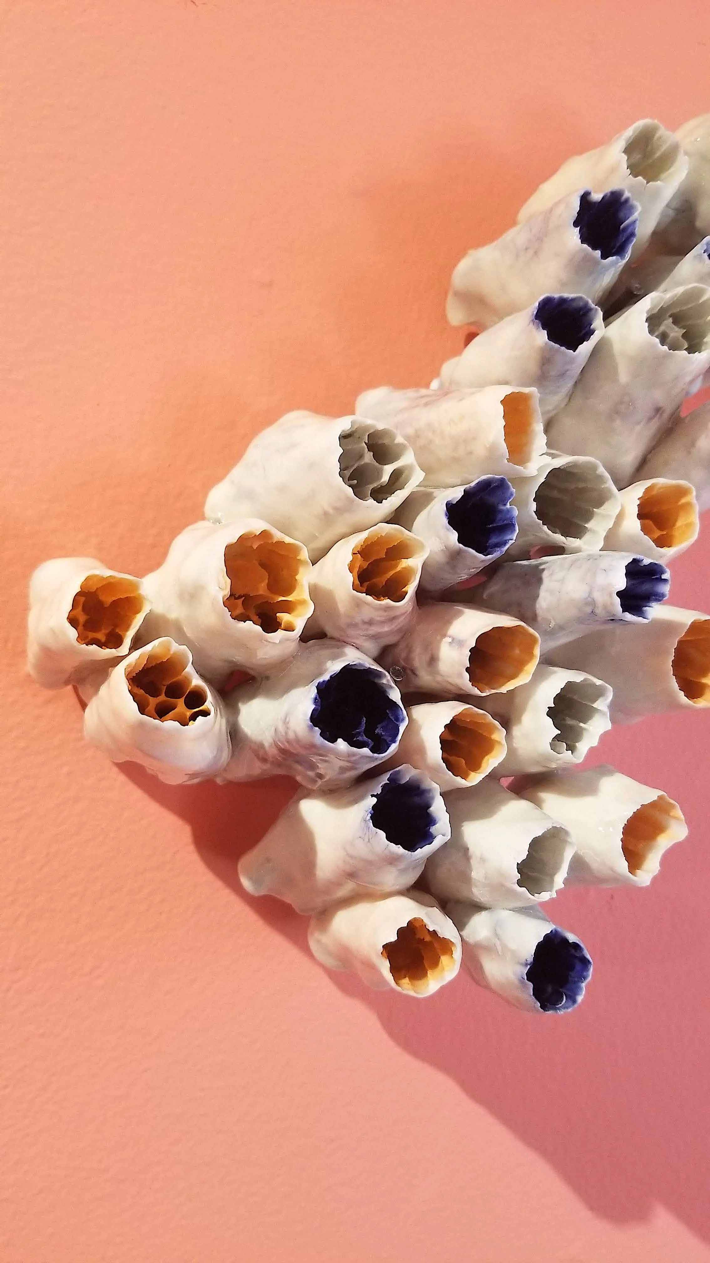 Ceramic sculpture with pink background