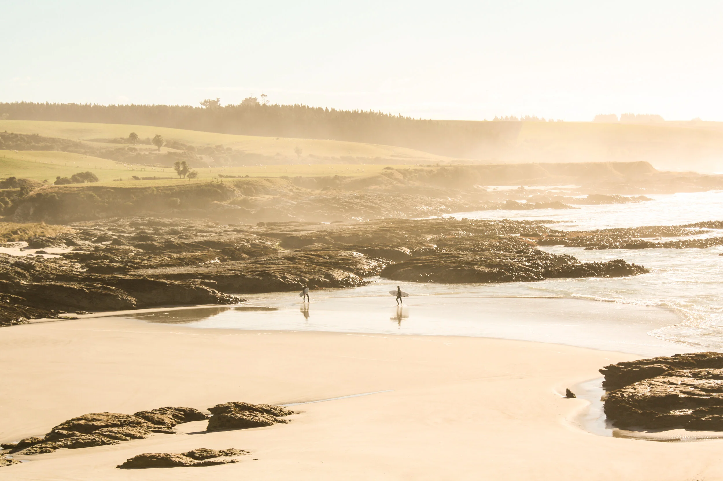 Taieri river mouth surfers.