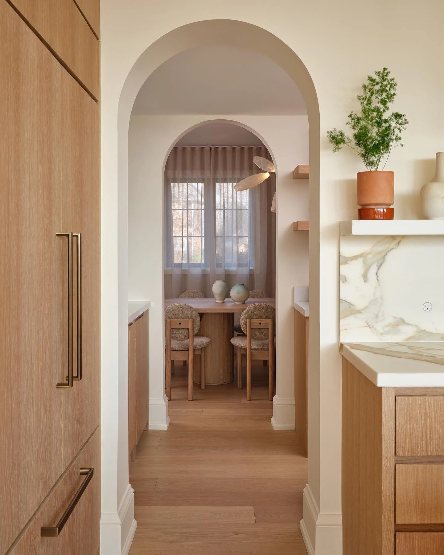 A beautiful view of the transition from kitchen to dining at Project Riverside 🤍