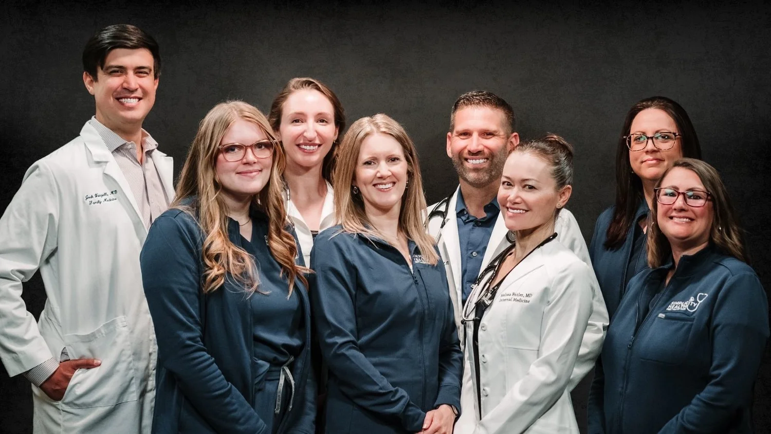 The Simplicity Health Direct Primary Care team — four board-certified physicians with their nurses and patient coordinators