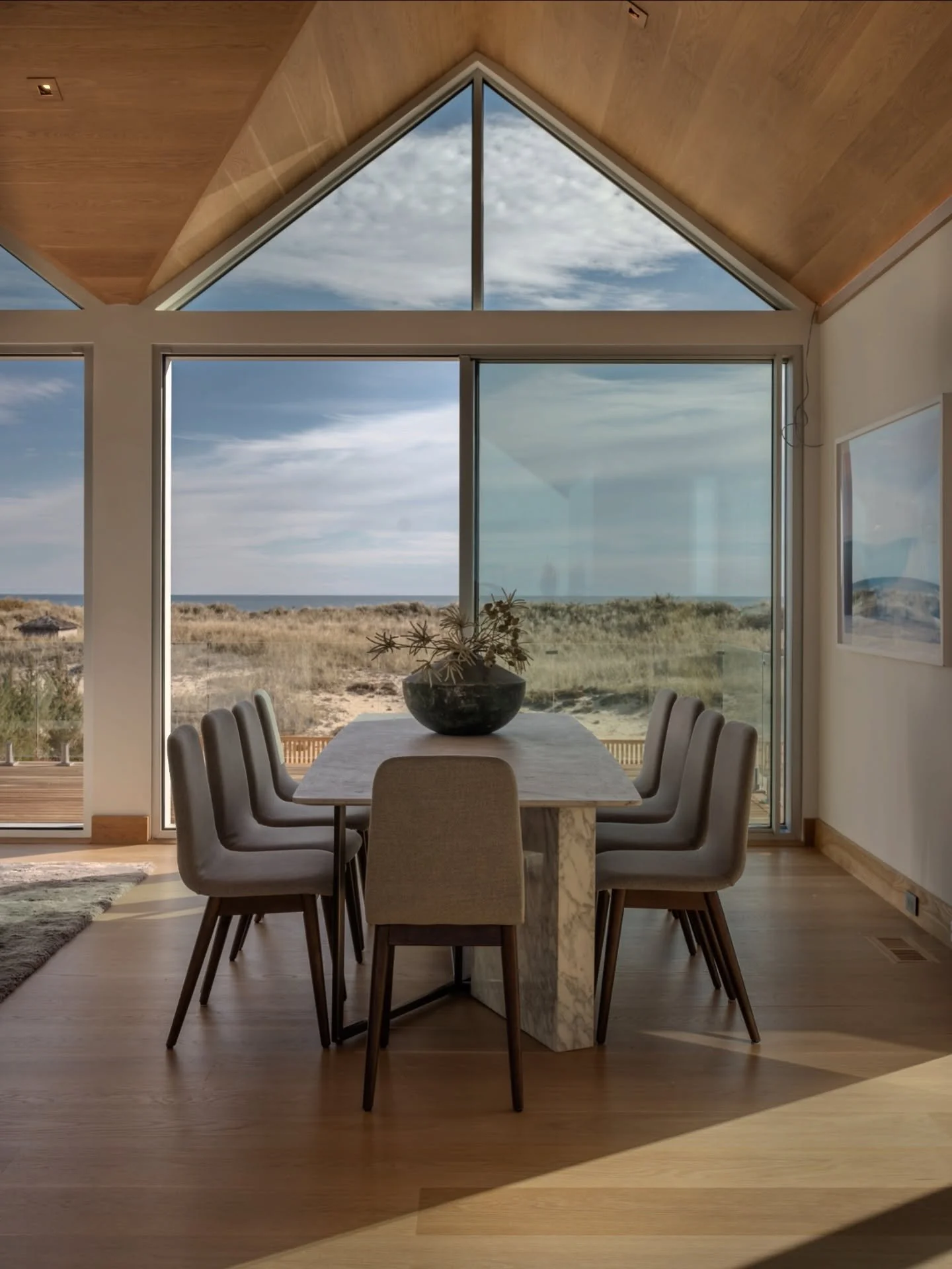 Dining with the dunes.
A moment where the coastline becomes part of the design&mdash;soft, modern, and curated to frame the view, not compete with it.

Just staged by Iconic Modern.

#Montauk #HamptonsLuxury #IconicModernHome #StagedToSell #HamptonsR