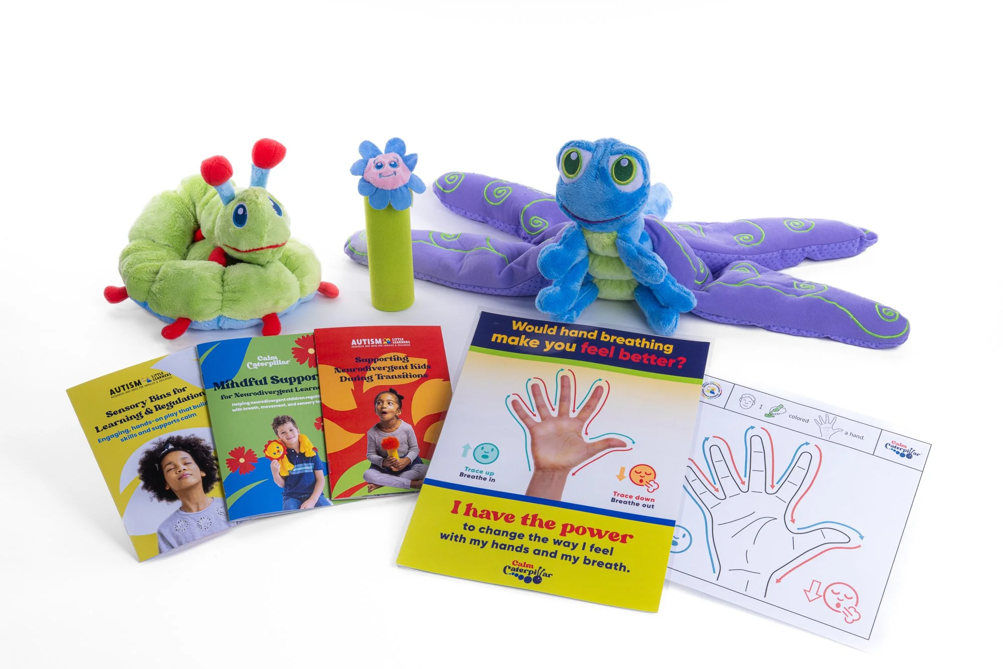 Children's educational autism support materials with plush toys, pamphlets, and activity sheets about breathing exercises and sensory bins.