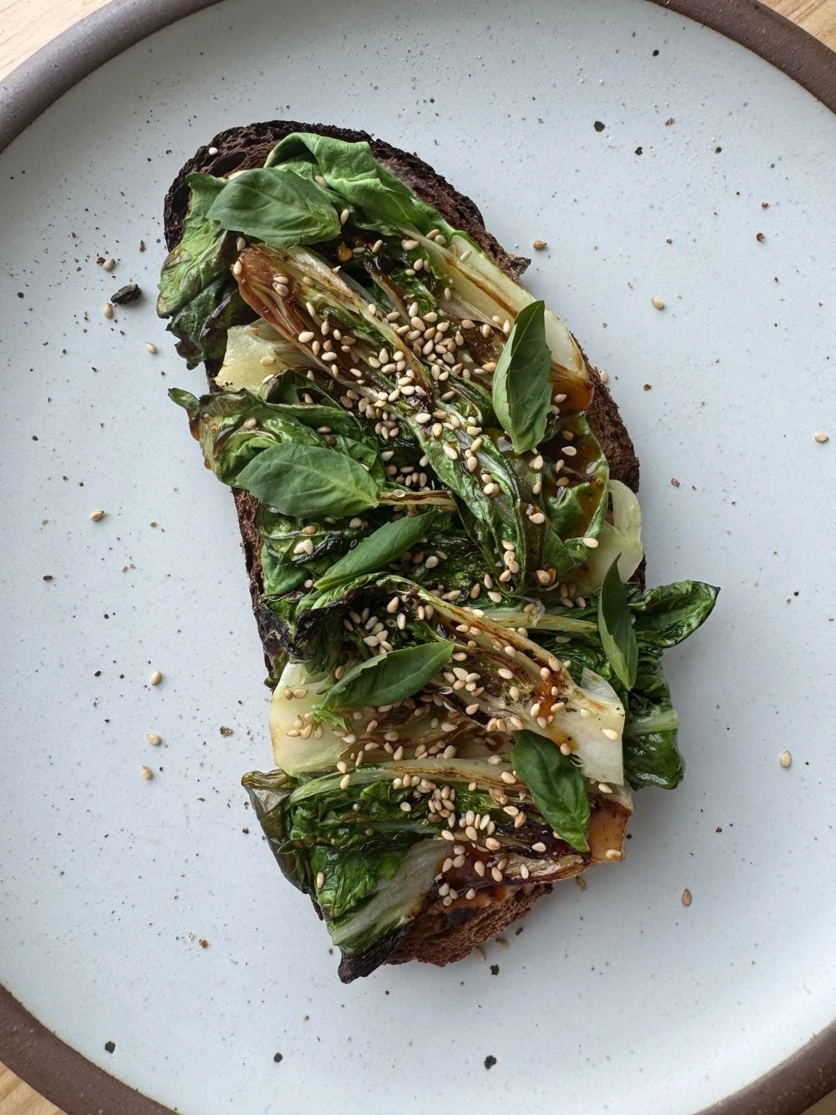 soy bok choy with spicy tahini on toast