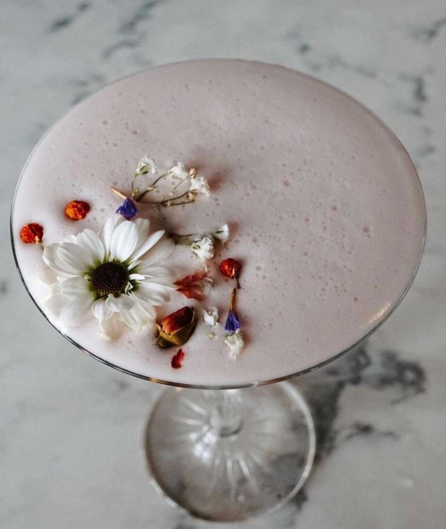 Talk about a craft cocktail masterpiece ✨

GARDENS OF THE GALAXY is shaken with hibiscus-infused vodka, limoncello, raspberry hibiscus syrup, chartreuse and egg whites; served straight up 🌺🍹

Link in bio for the full drink menu &amp; reservations. 