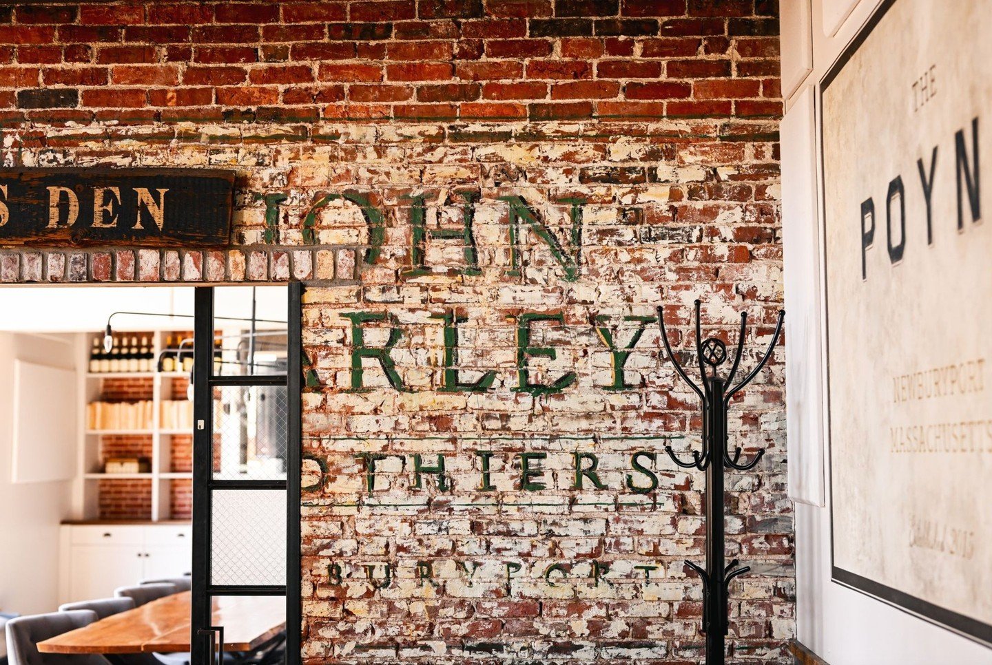 Ever notice the little bit of history hidden on the brick wall near The Wolfe's Den?  Before becoming The Poynt, our space was previously a Men's Clothier called John Farley's.  You may notice a nod to our space's past with the original John Farley's