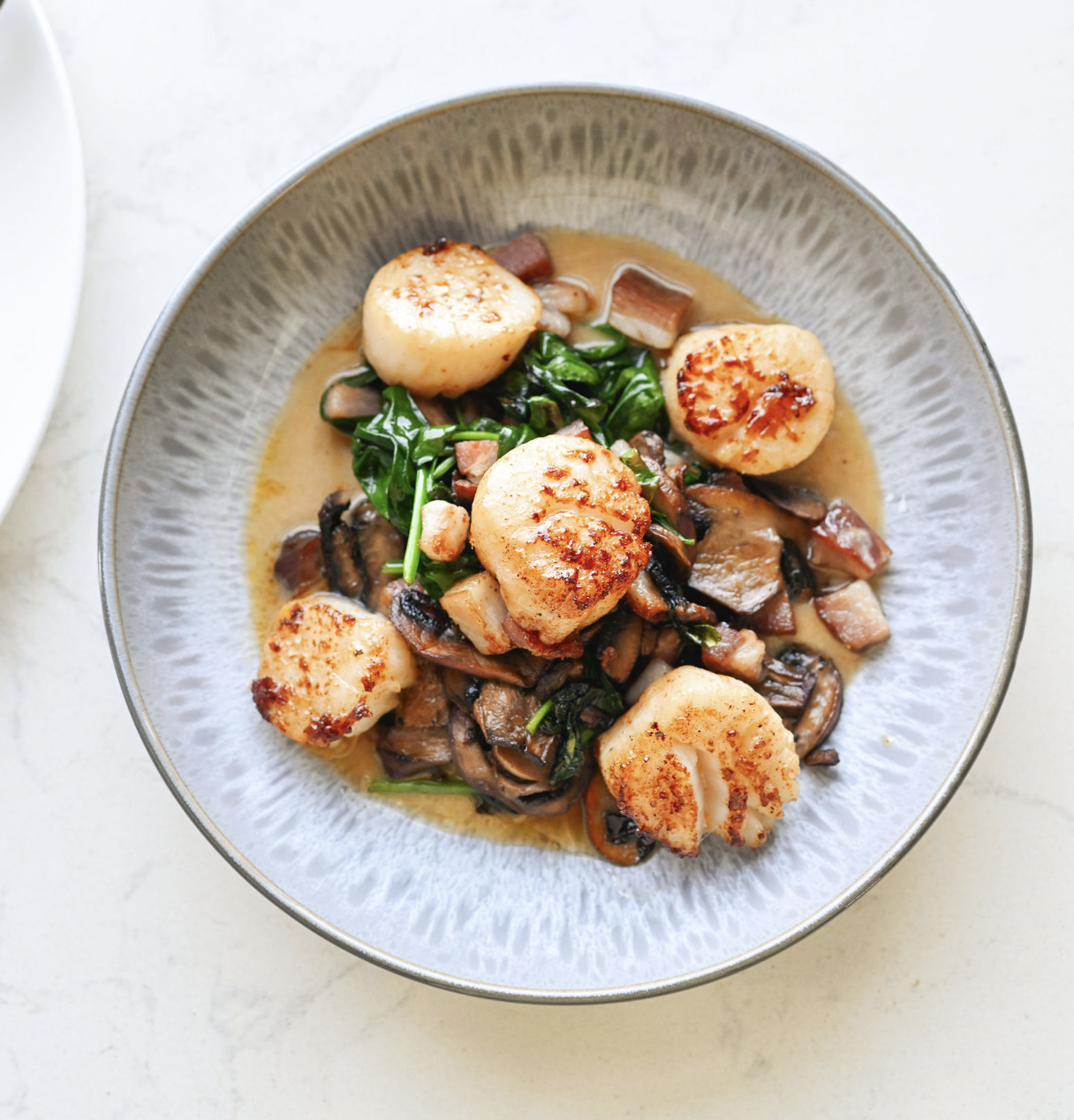 Pan-seared scallops plated at The Poynt, Newburyport MA