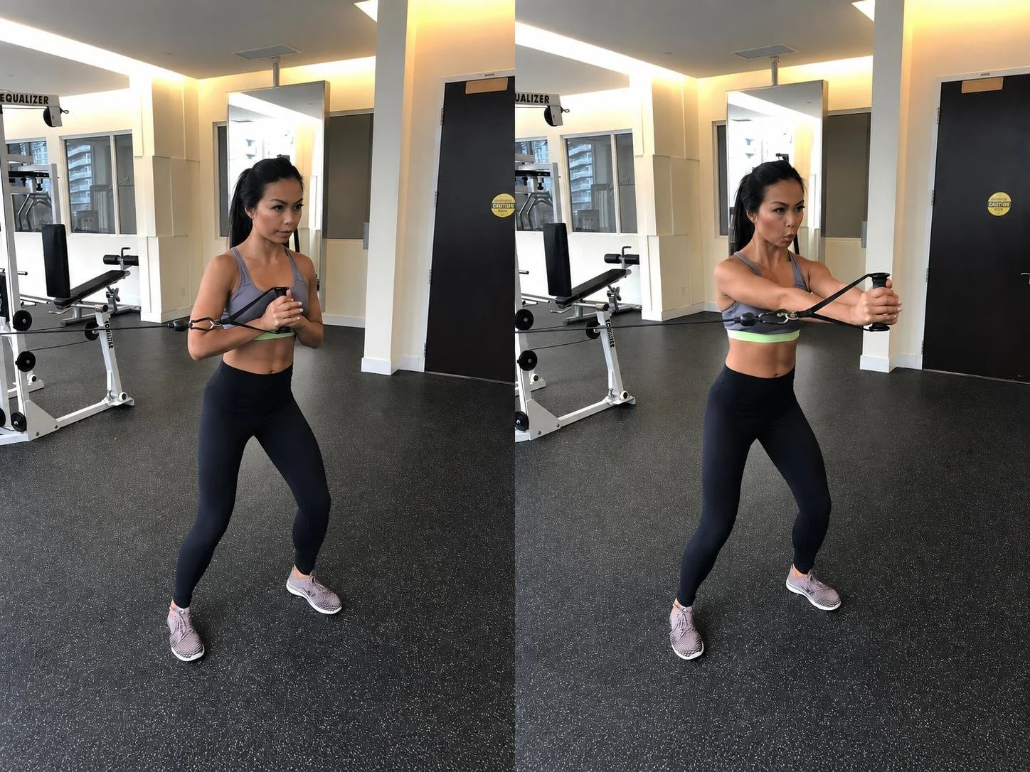 Woman performing a Pallof press exercise with a cable machine in a gym.
