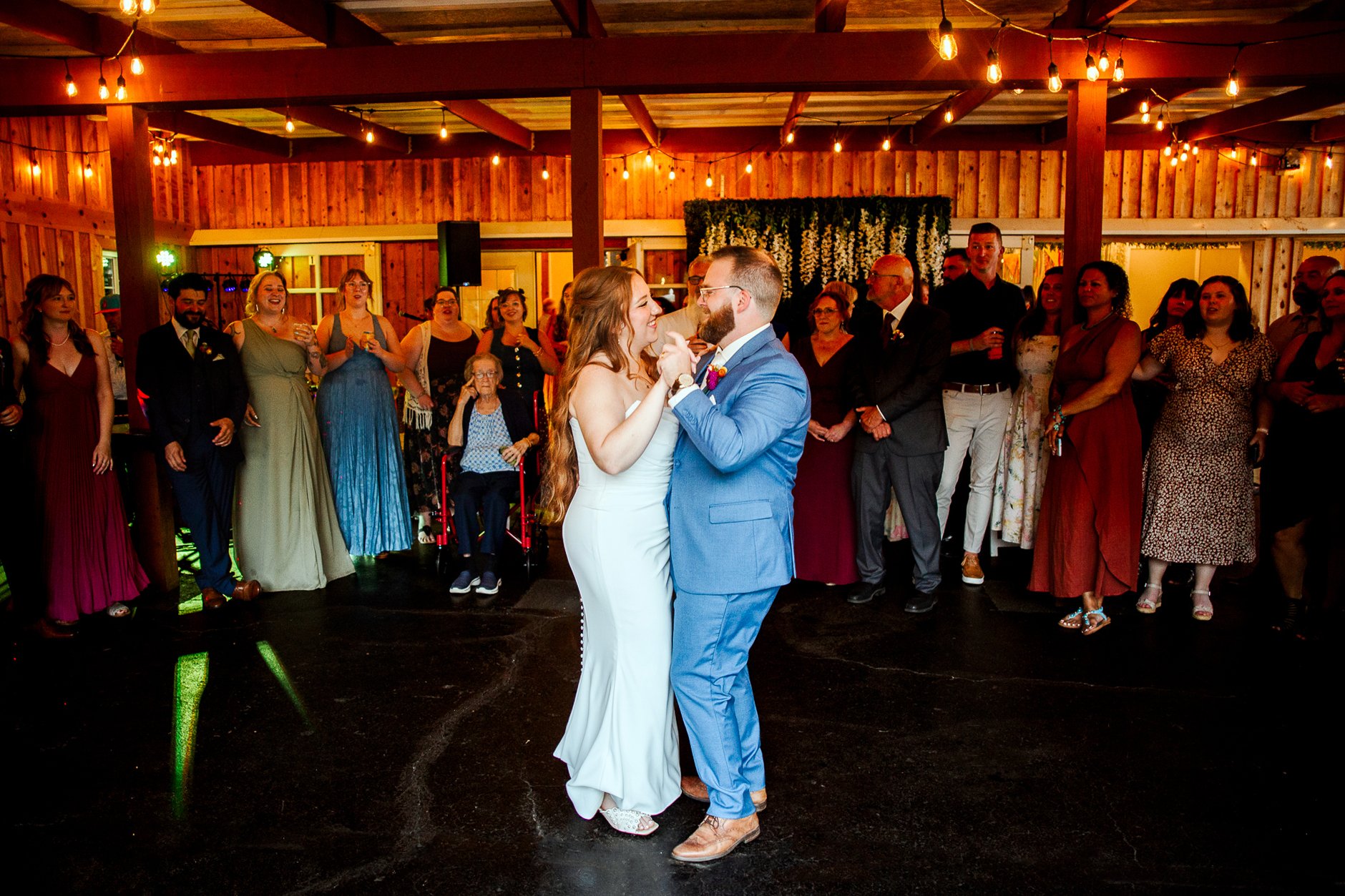 wide shot of bride and groom dancing their first dance as a married couple
