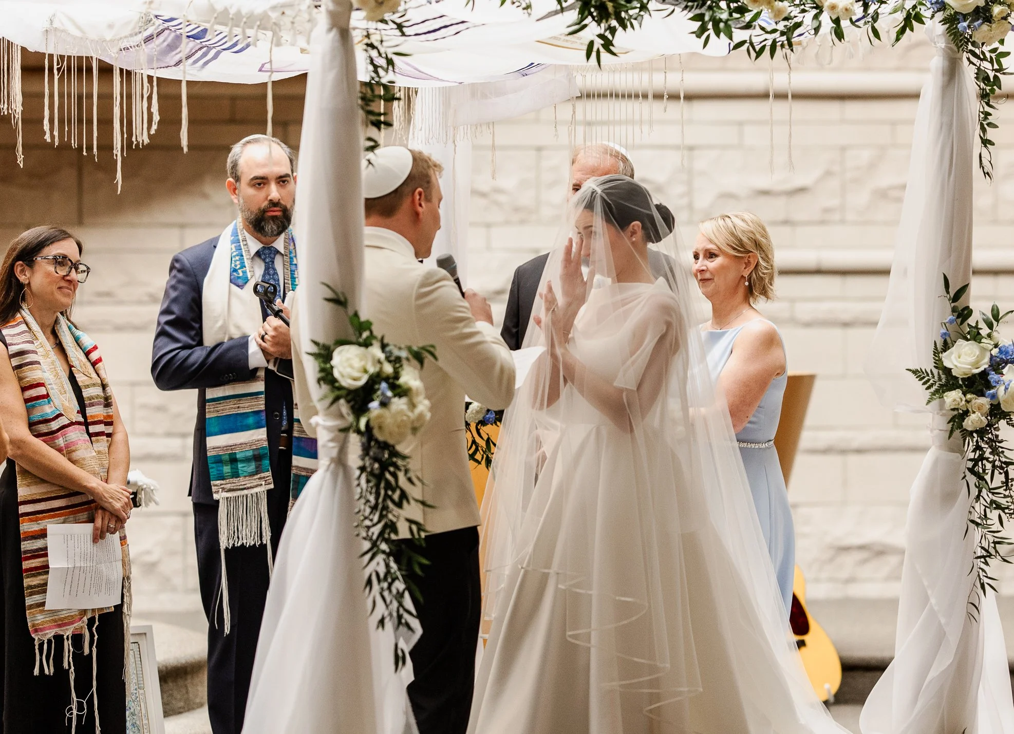 Sarah and Owen during their Jewish wedding ceremony at Temple Shir Shalom
