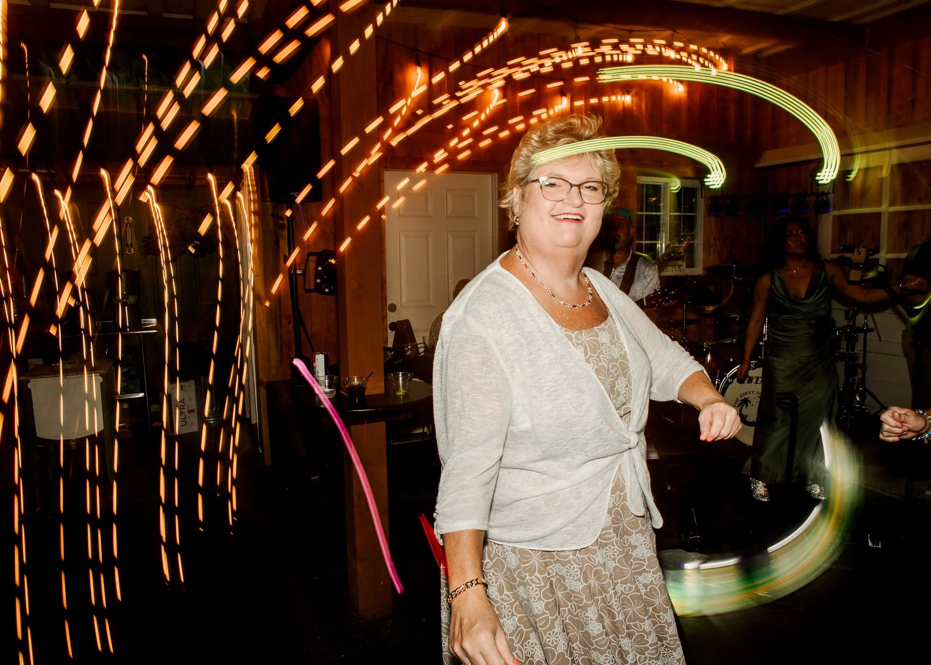 wedding guest dancing together on a dark dance floor