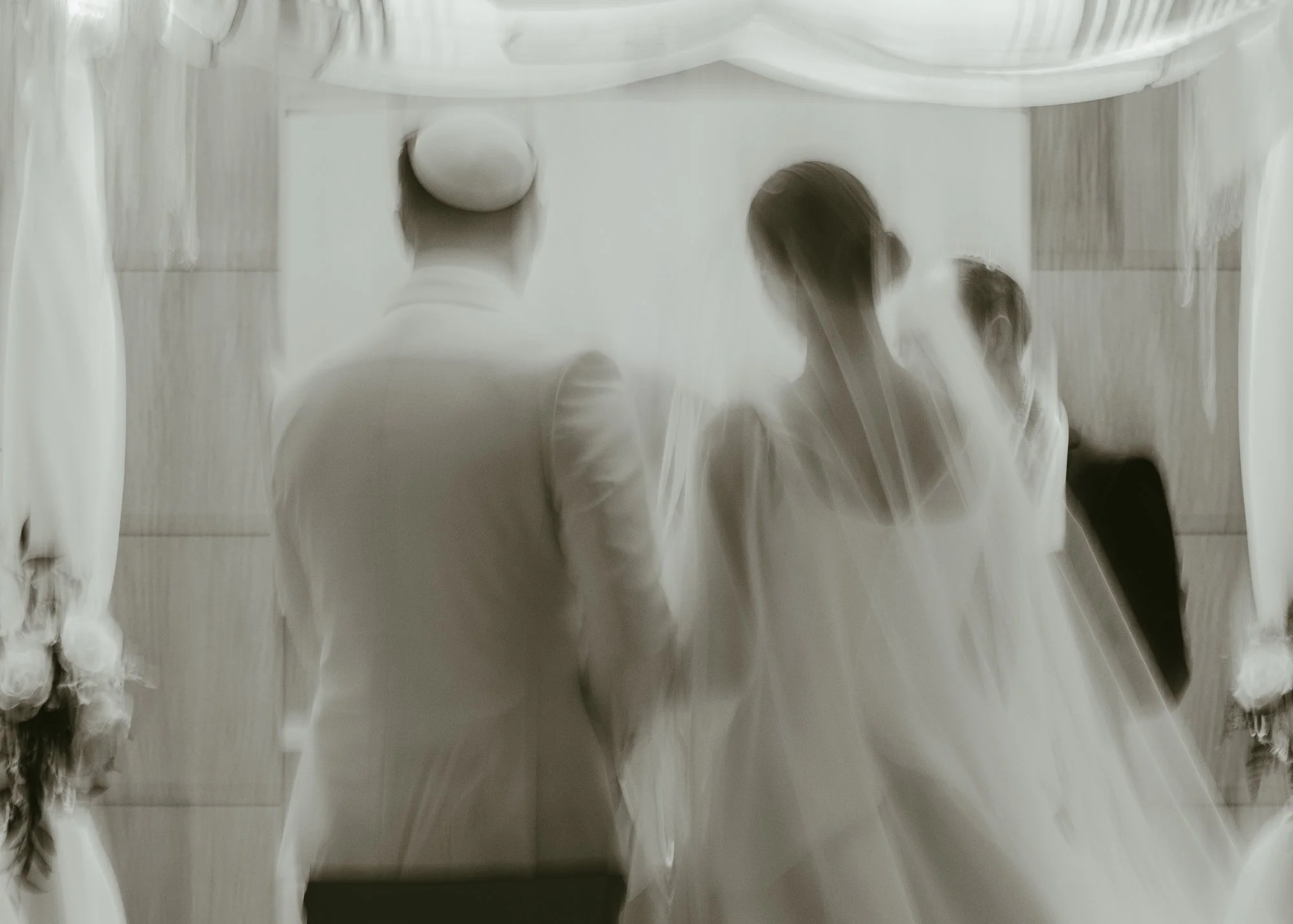 Sarah and Owen during their Jewish wedding ceremony at Temple Shir Shalom