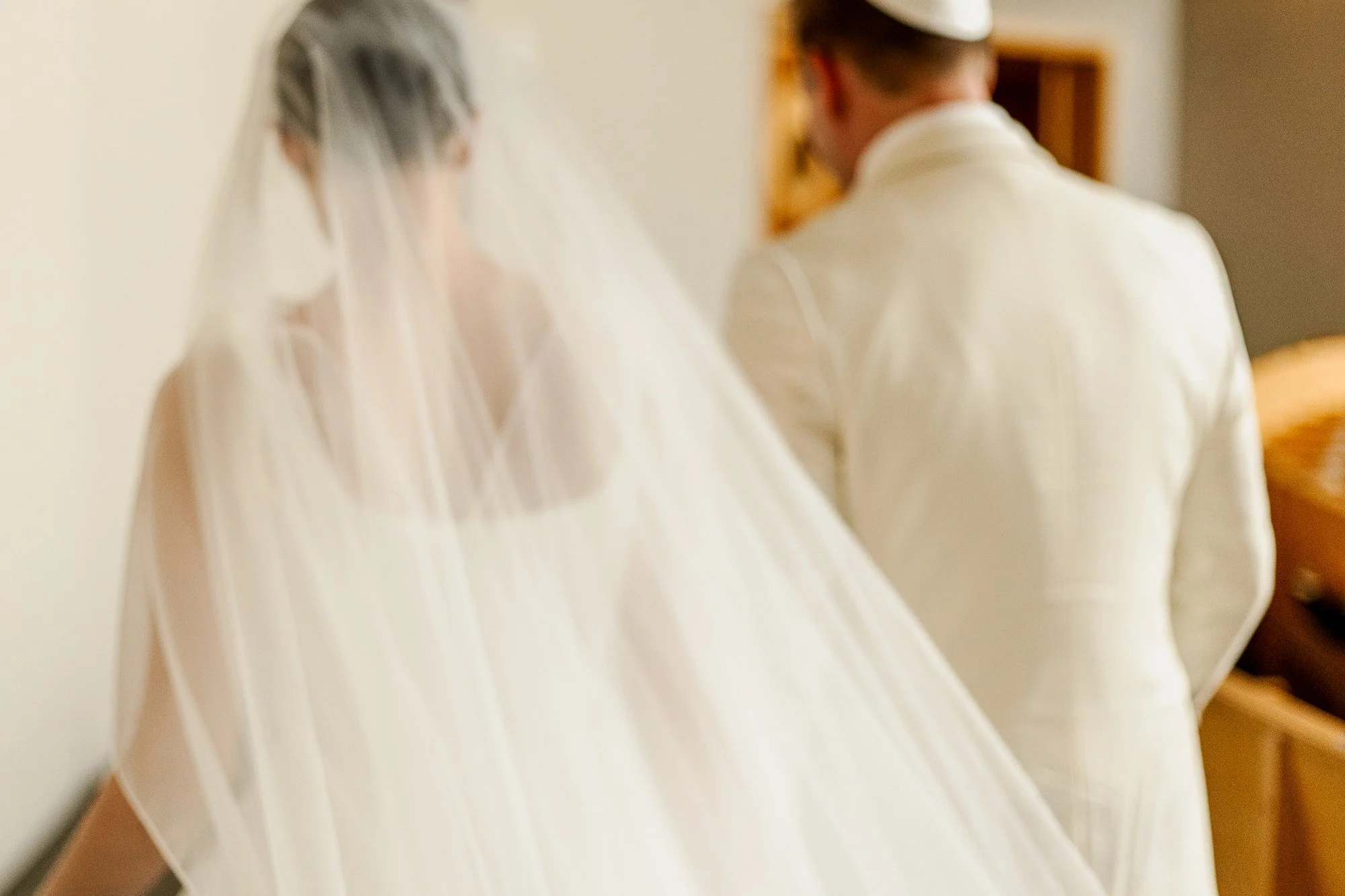 Sarah and Owen exiting ceremony in the Temple Shir Shalom sanctuary