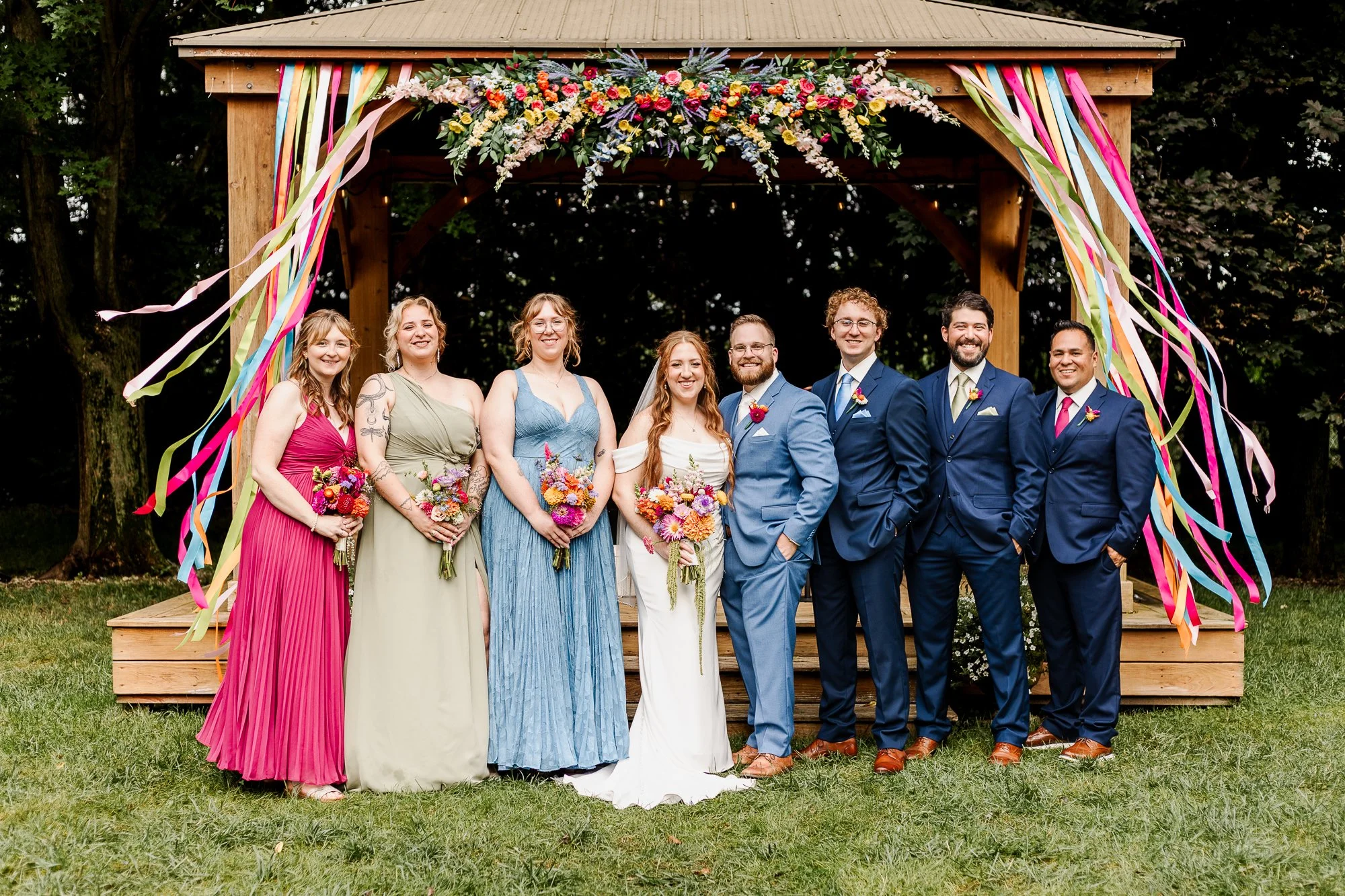 wide shot of wedding party standing in front of gazebo at bloom and bower in rising sun ohio