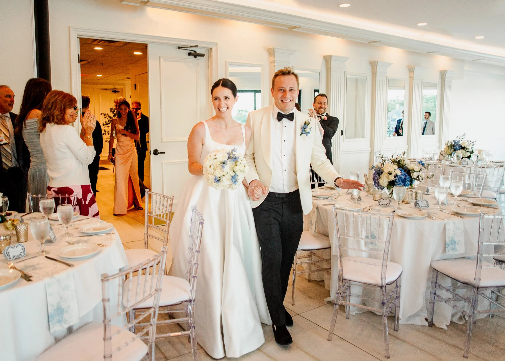 Sarah and Owen entering the event space at Aurora Italiana for their wedding reception