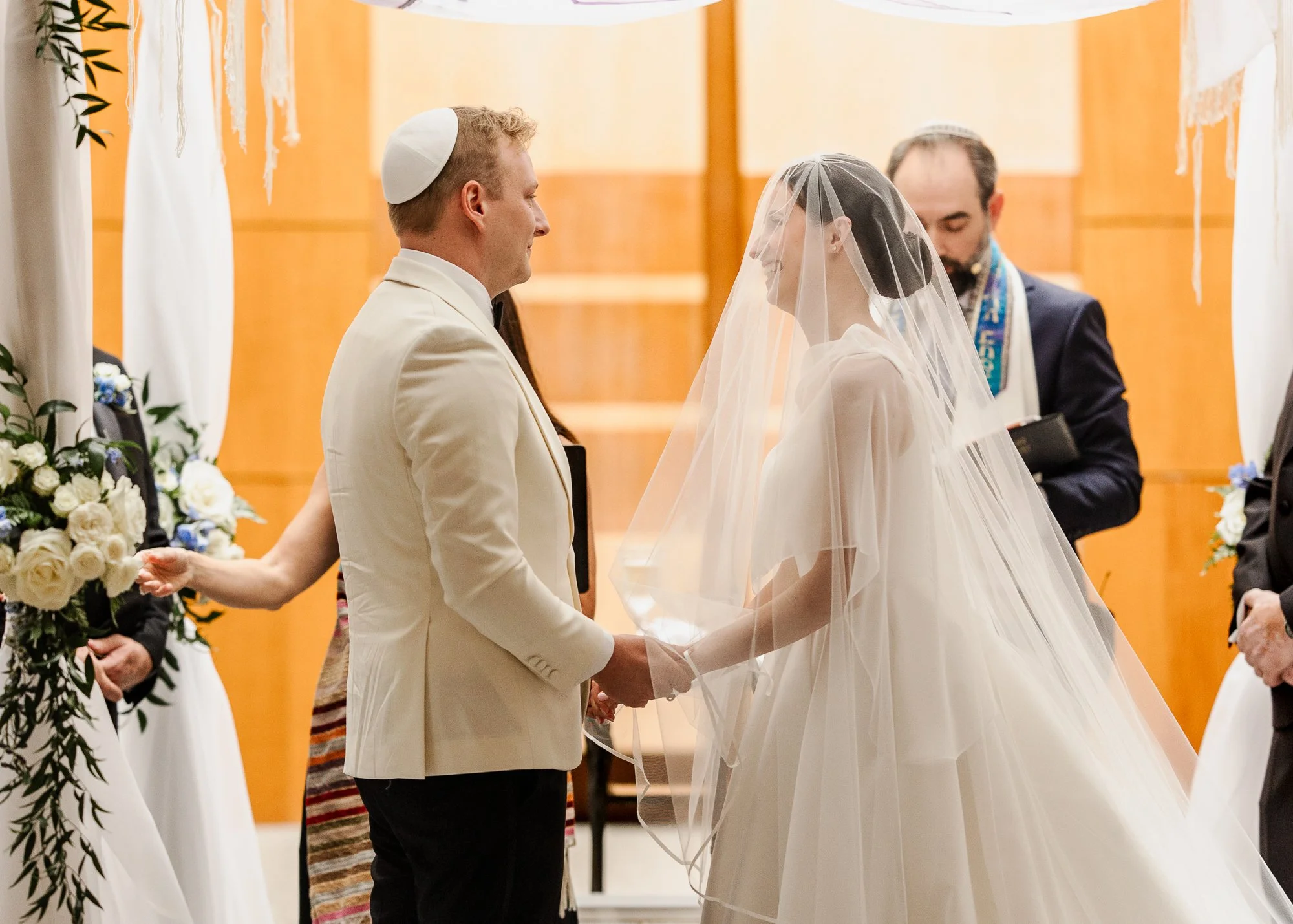 Sarah and Owen during their Jewish wedding ceremony at Temple Shir Shalom