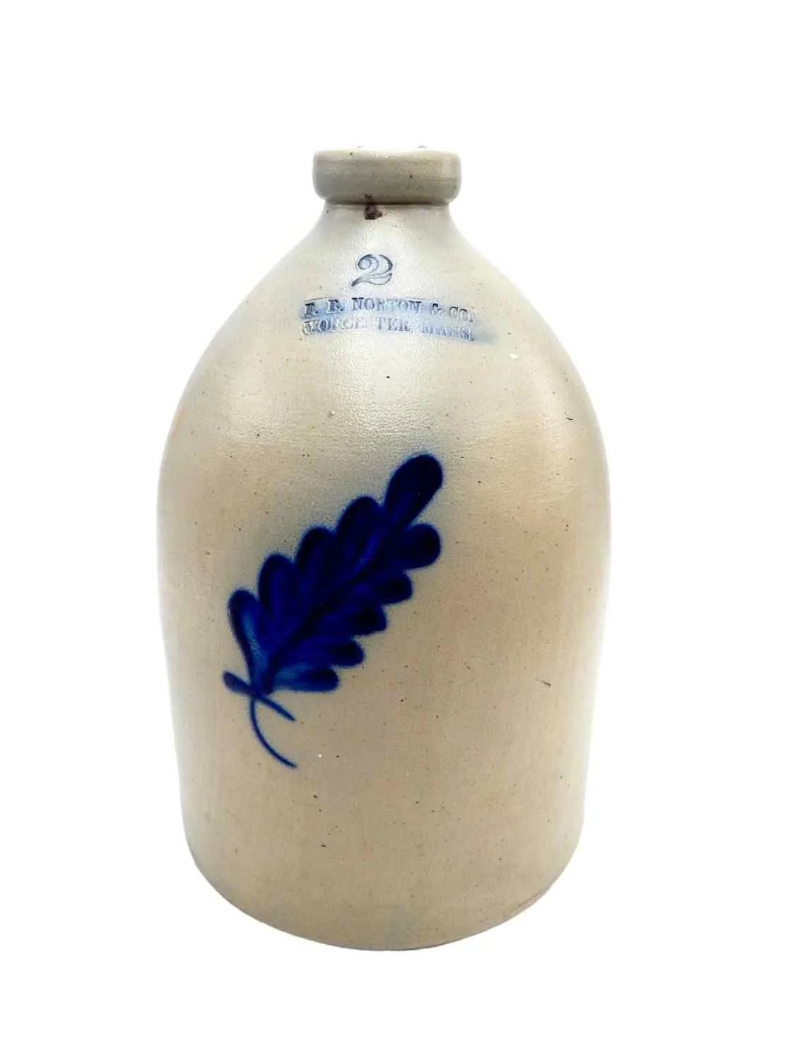 Stoneware two gallon jug with a cobalt blue enameled fern frond design