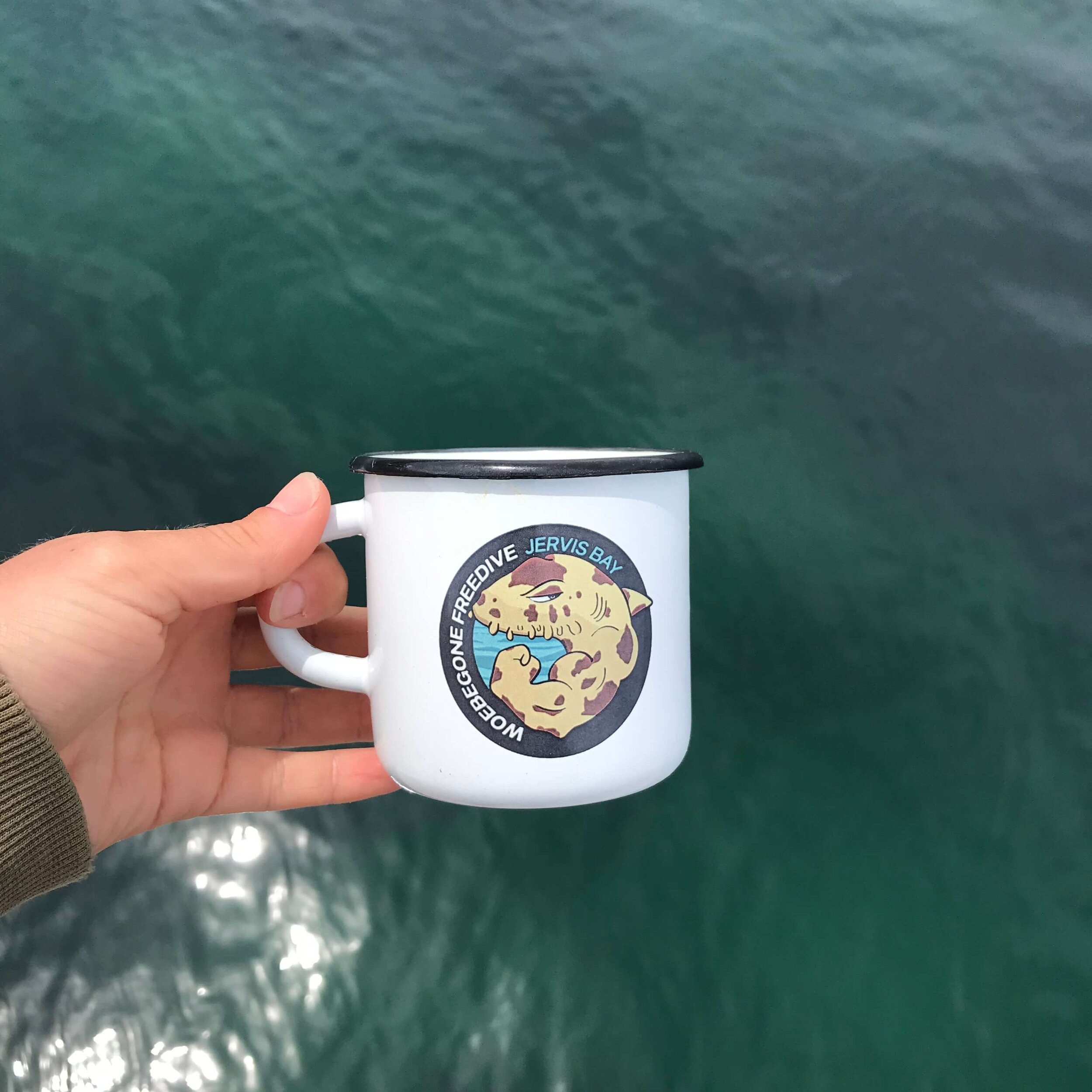 Woebegone enamel camp mug at Murrays beach.jpeg
