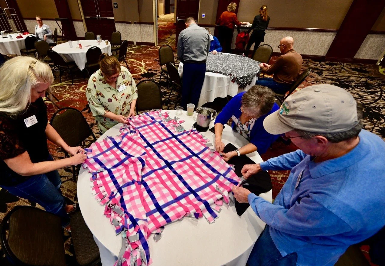 Making knotted blankets for shelters.