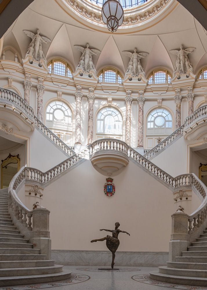Entrance of the Gran Teatro de La Habana in Havana, Cuba, featuring its ornate facade and the statue of ballerina Alicia Alonso in front.