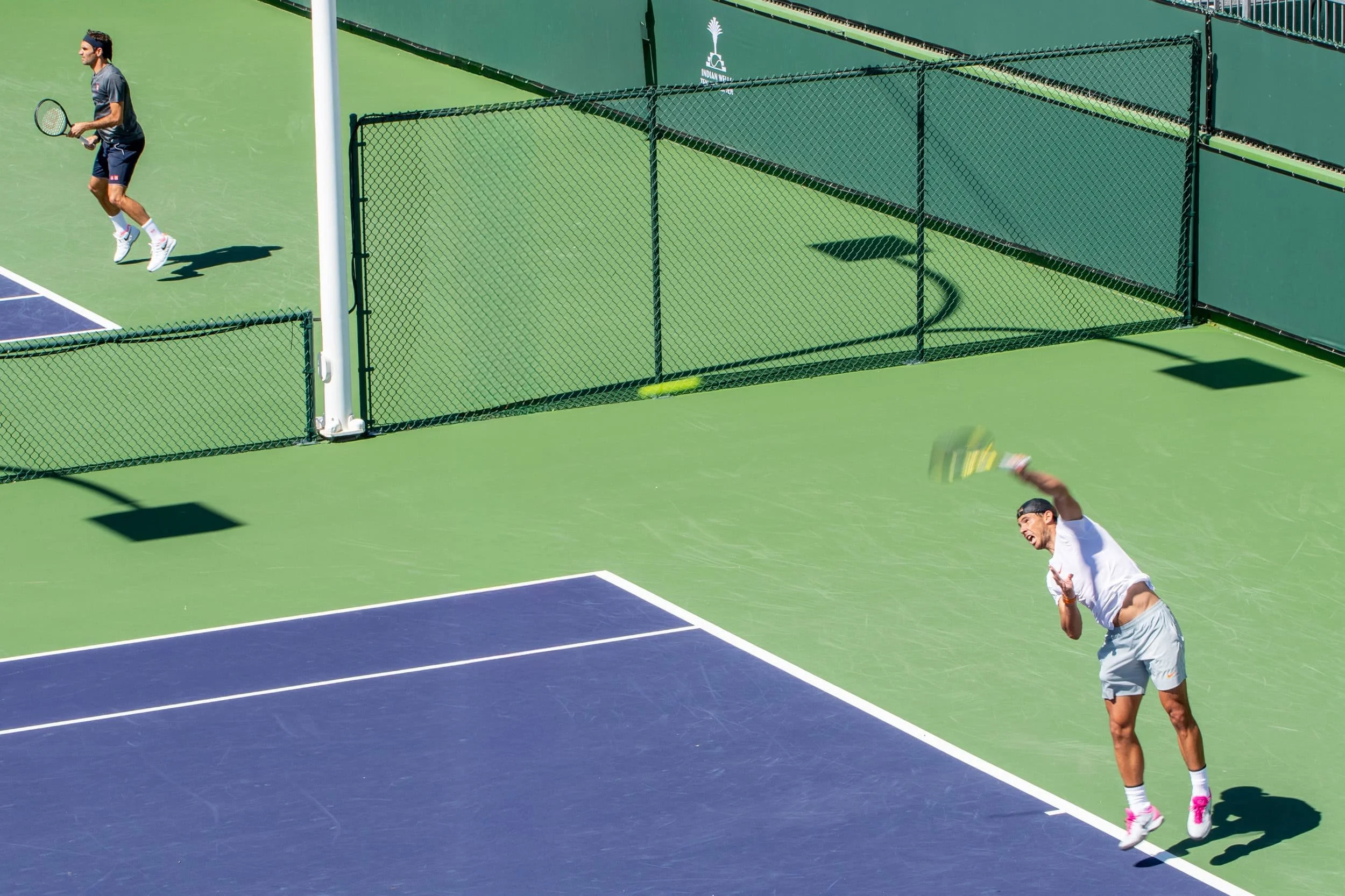 Roger Federer and Rafael Nadal pracicing next to each other, at the 2019 Indian Wells, CA.