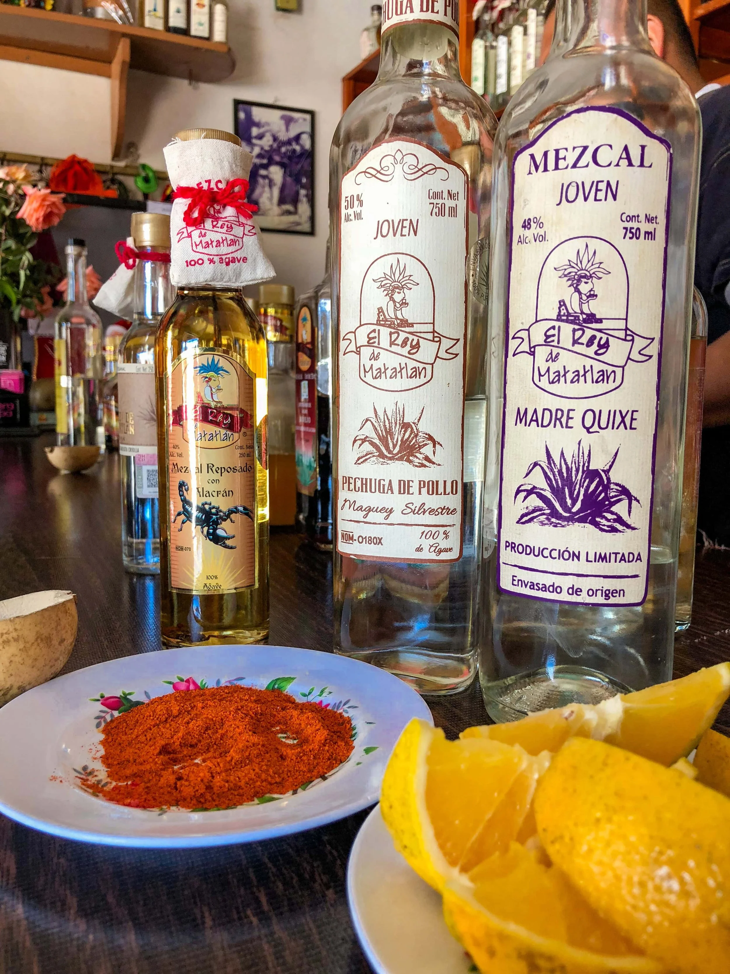 Mezcal Tasting with Orange, chilly powder, and showcasing mezcal blanco y mezcal reposado
