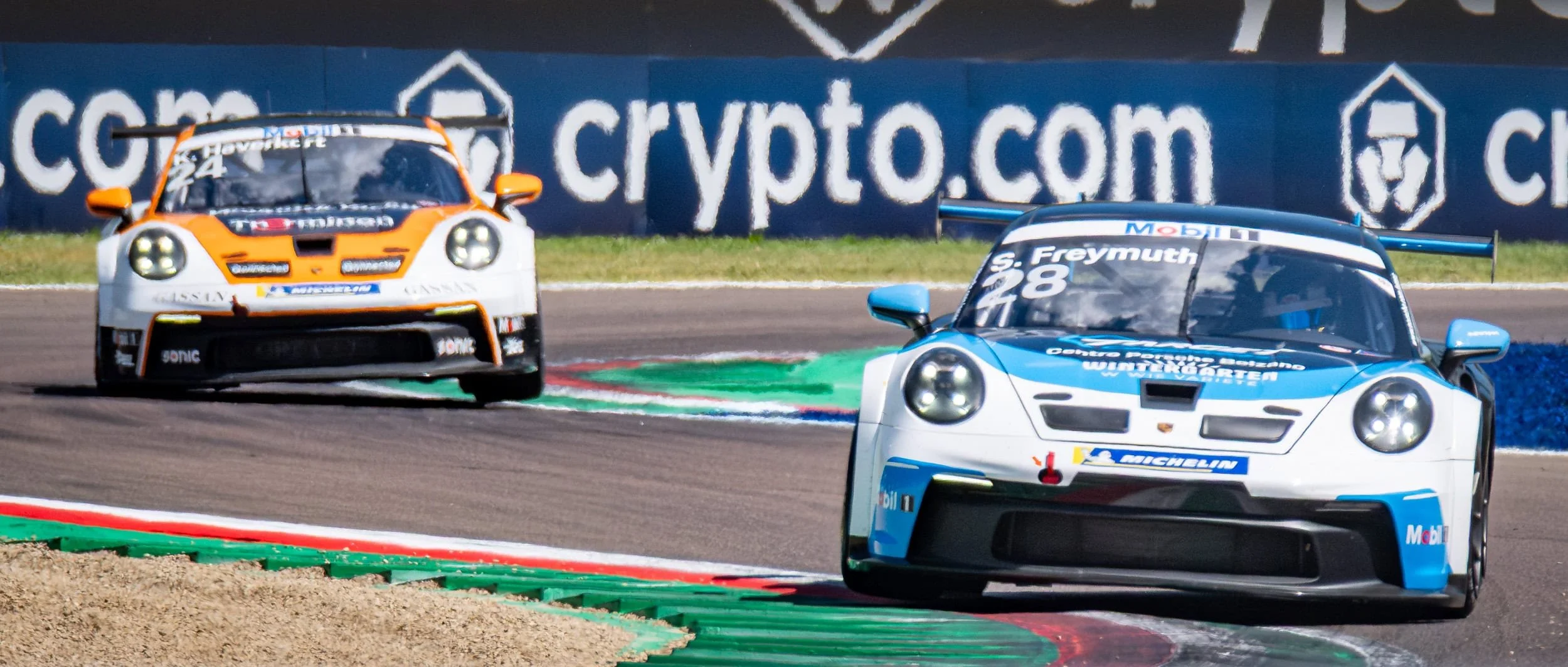 Two Porsche 911 Cup cars at turn 1 during the Imola Grand Prix Weekend.