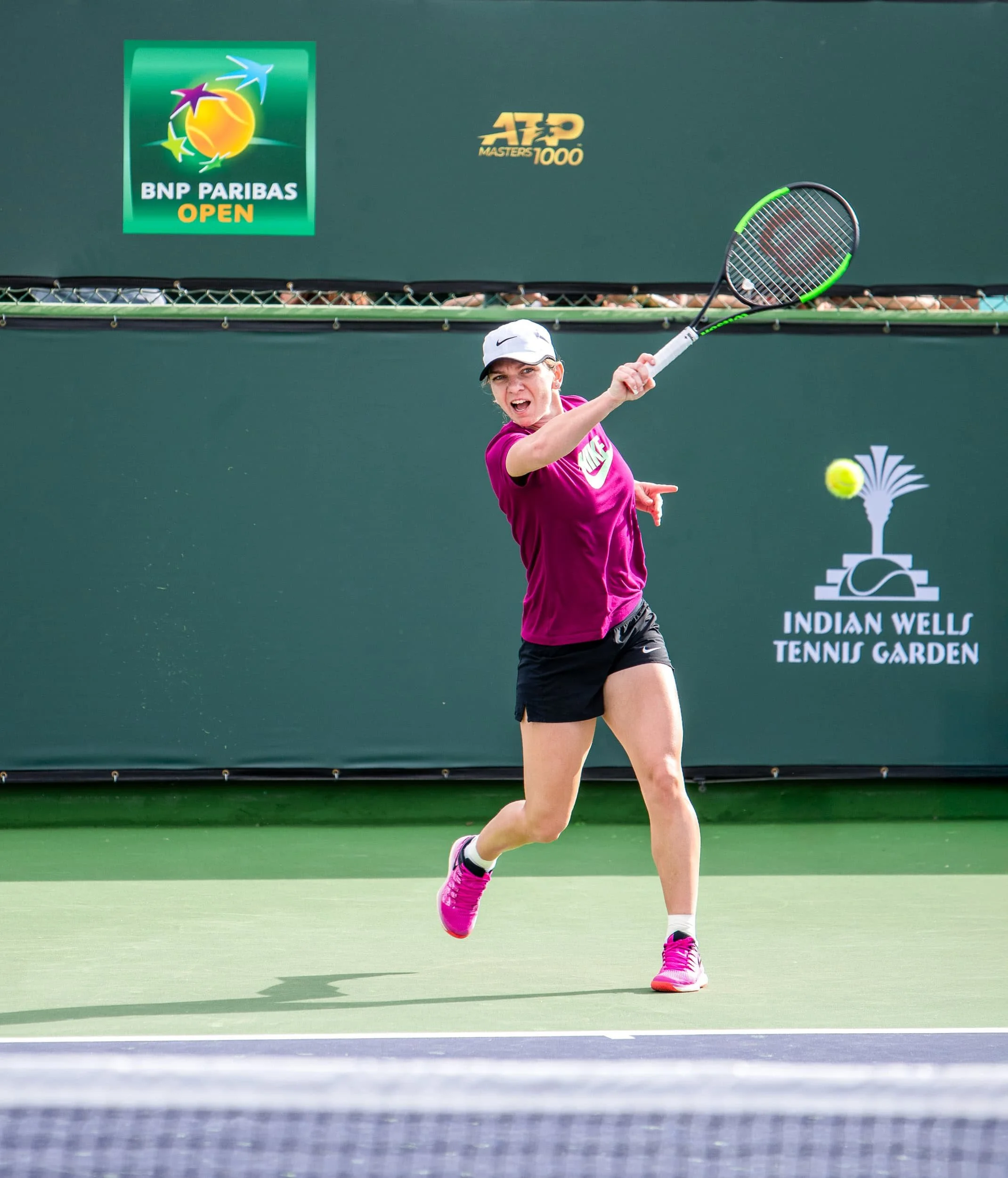 Simona Halep, hits a heavy top-spin forehand during a practice session, at 2019 Indian Wells in California. I love to attend the practice sessions, you get so close to the action.