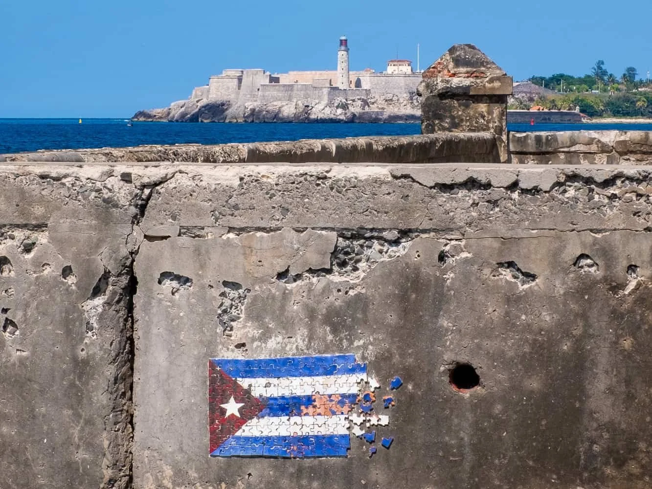 El Morro fortress with a torn Cuban flag in Havana.